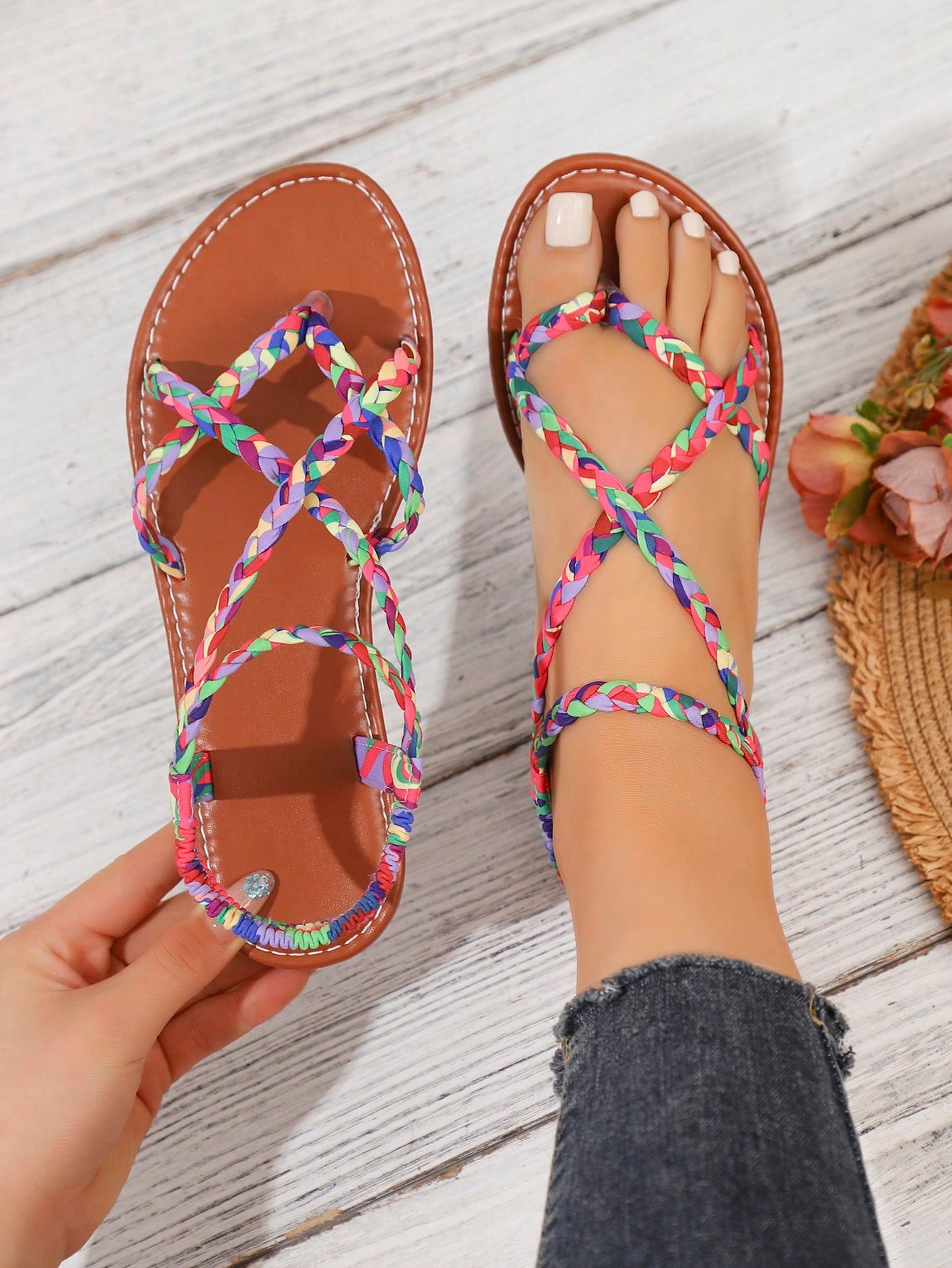 Women's woven criss-cross elastic flat sandals with braided strappy upper and toe post design