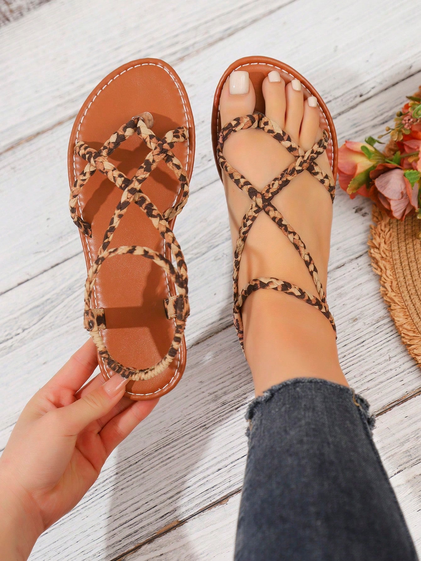 Women's woven criss-cross elastic flat sandals with braided strappy upper and toe post design