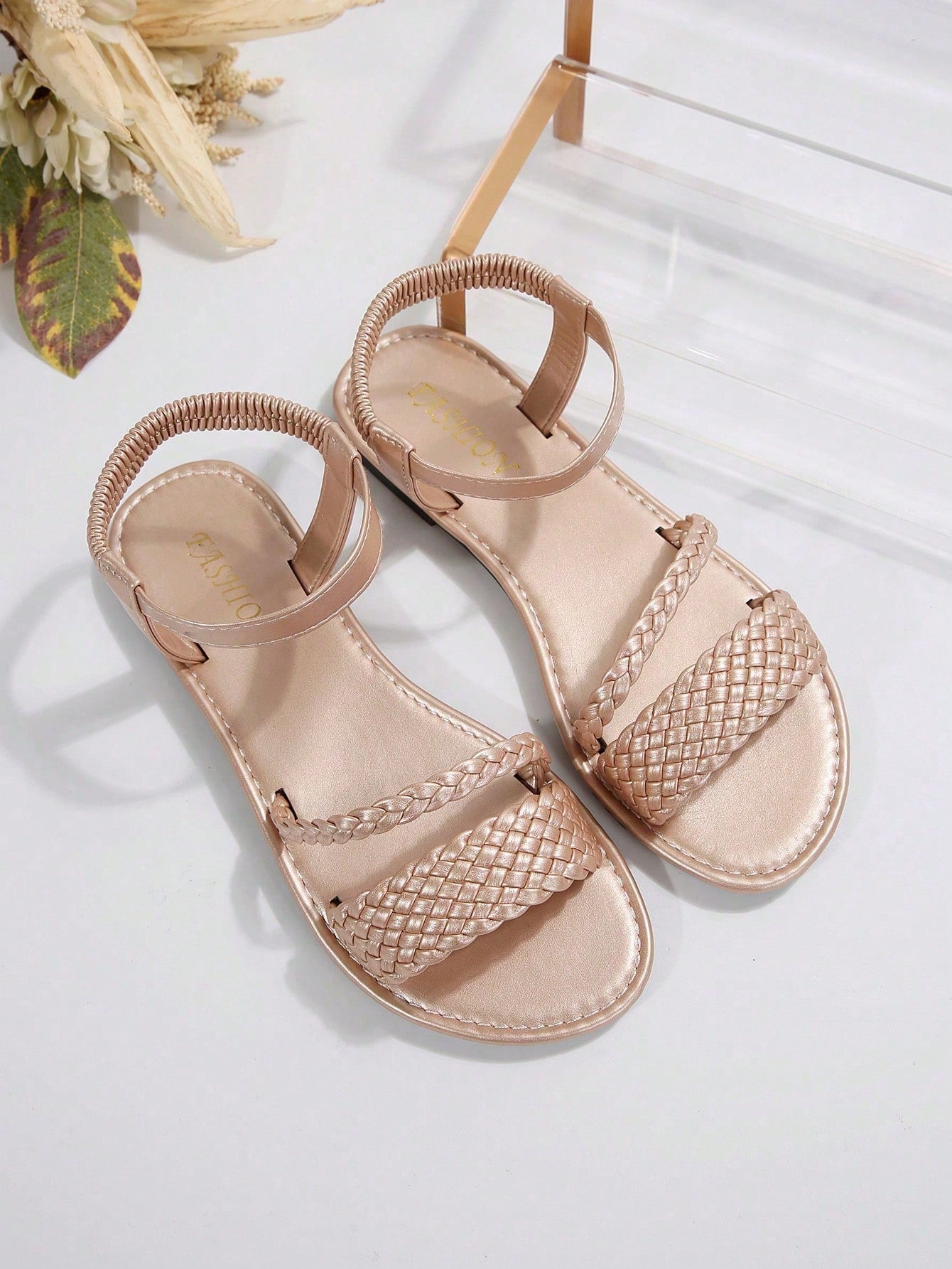 Women's plus size flat slide sandals with woven braid detail, open toe design, and elastic band strap, suitable for casual outdoor, beach, and vacation wear.