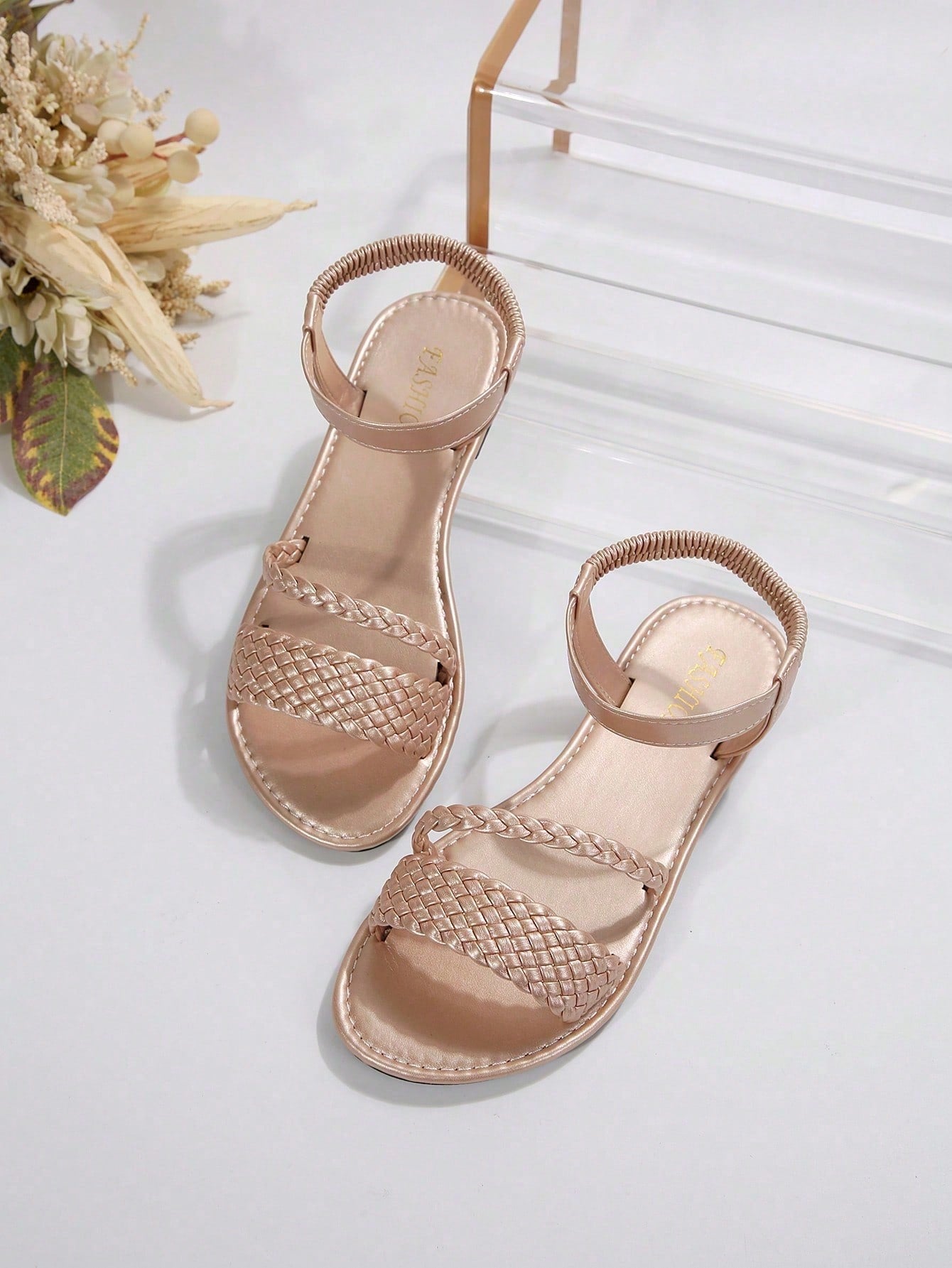Women's plus size flat slide sandals with woven braid detail, open toe design, and elastic band strap, suitable for casual outdoor, beach, and vacation wear.