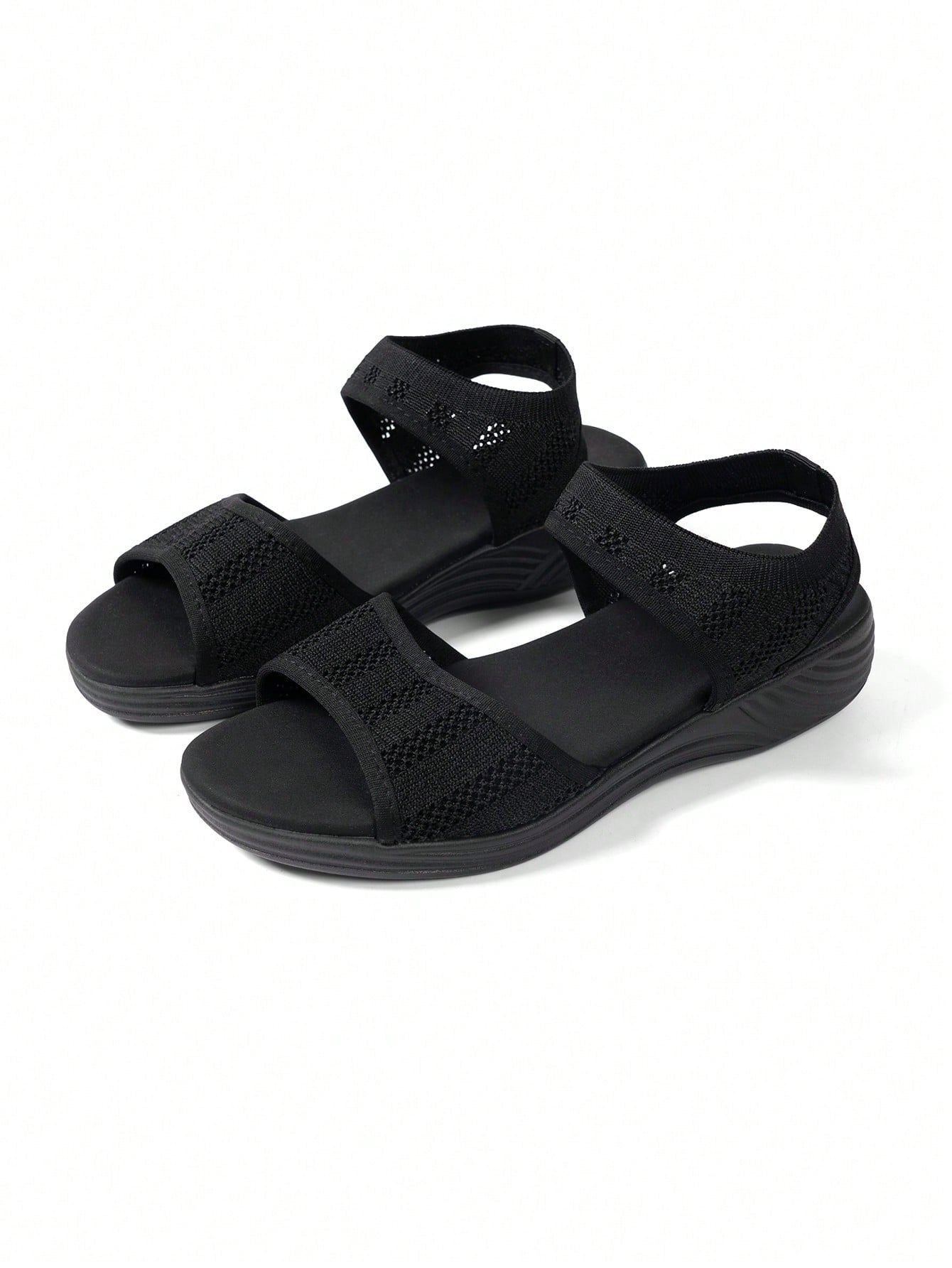 Women's slip-on Roman style platform sandals with breathable cut-out upper, open toe, and flat outdoor-ready sole.