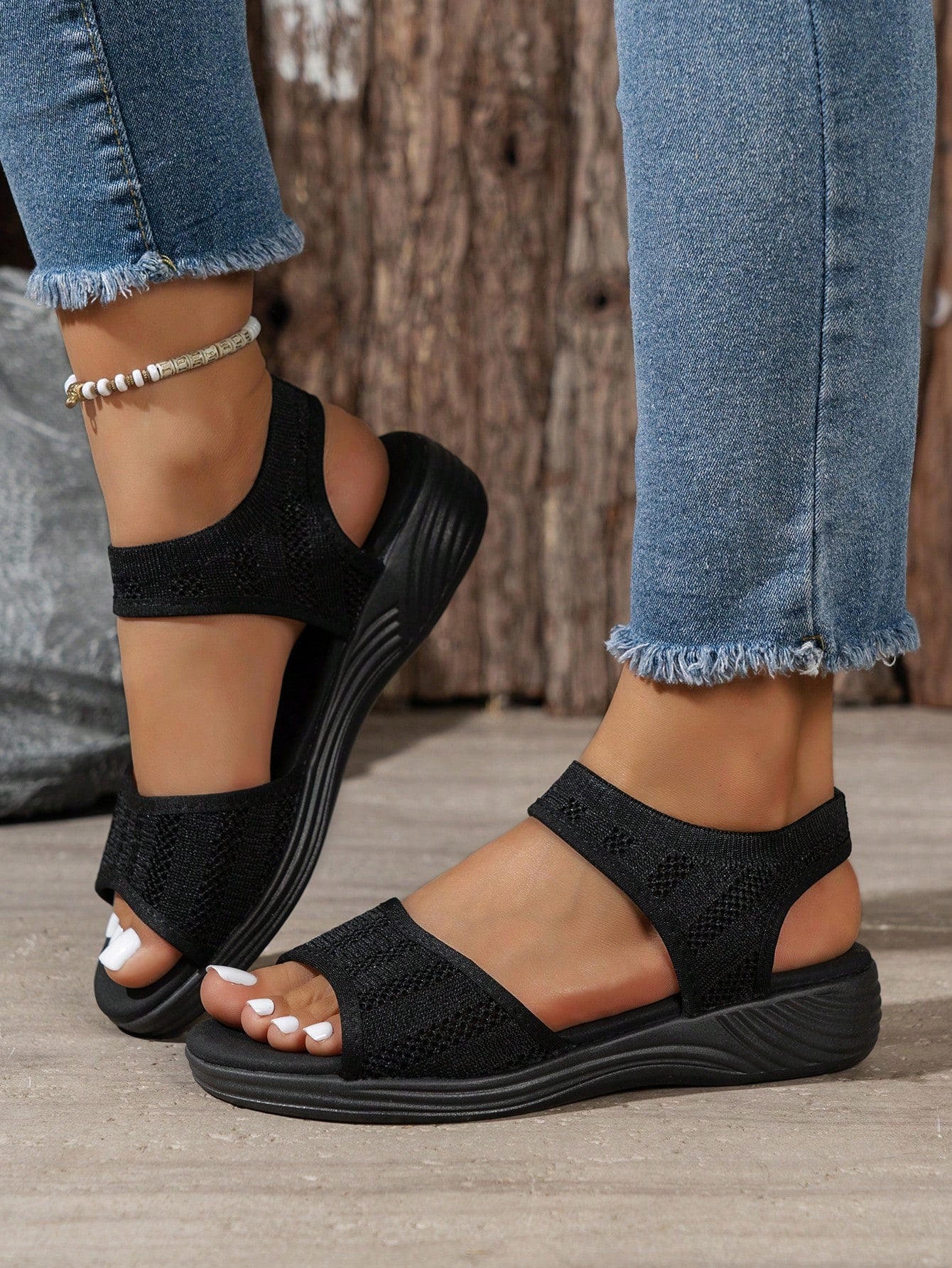 Women's slip-on Roman style platform sandals with breathable cut-out upper, open toe, and flat outdoor-ready sole.