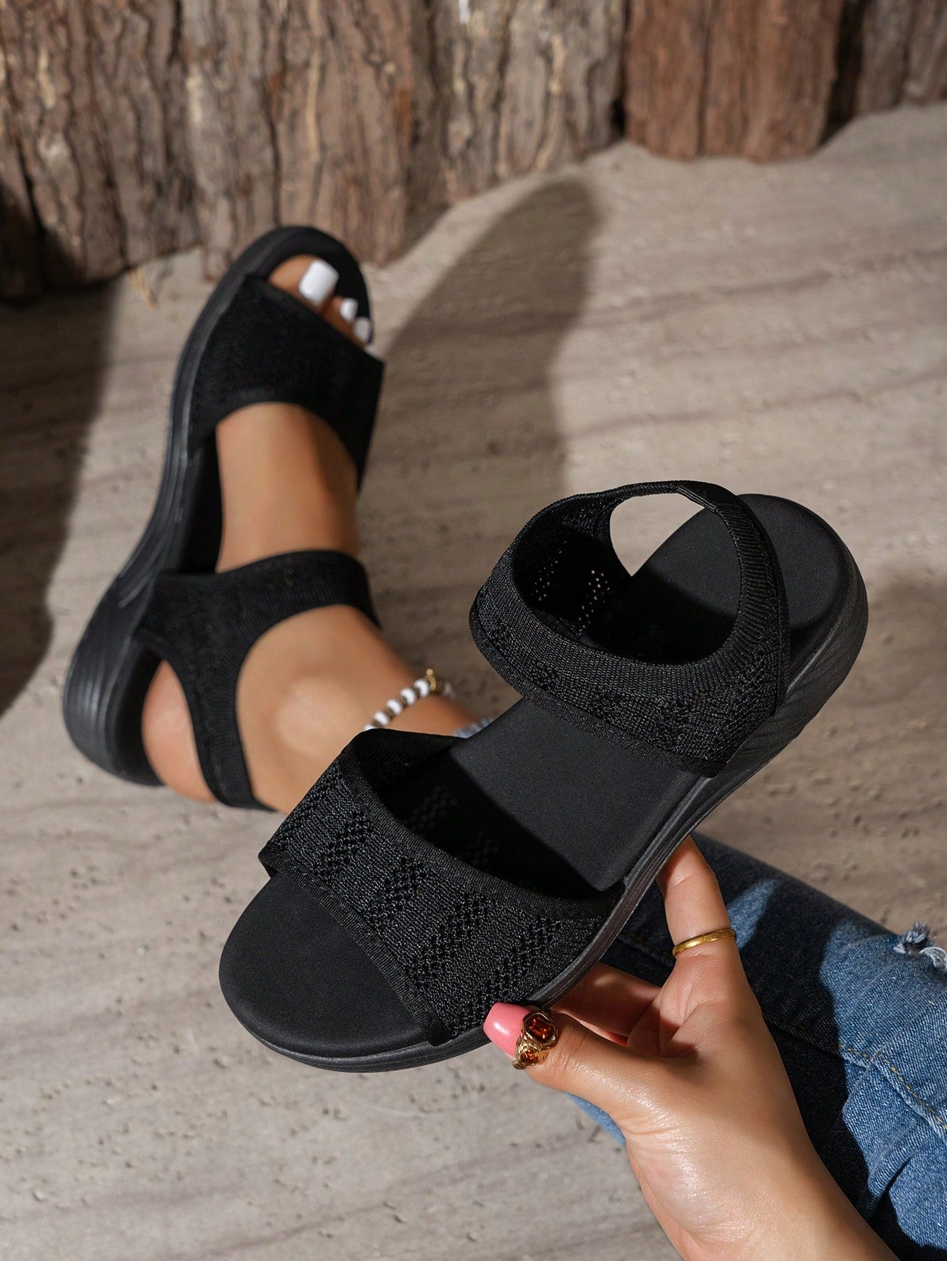 Women's slip-on Roman style platform sandals with breathable cut-out upper, open toe, and flat outdoor-ready sole.