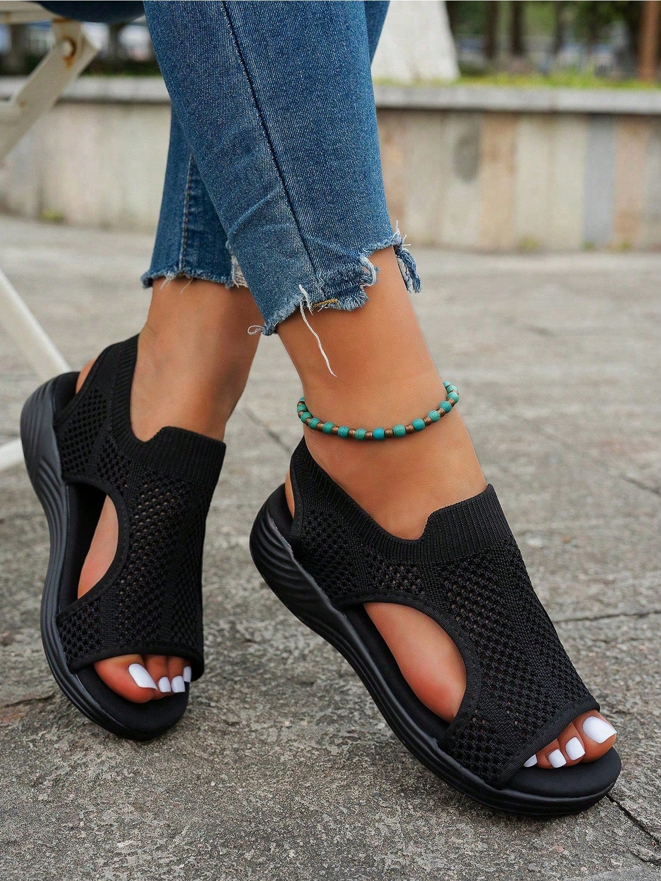 Plus size women's slip-on wedge slide sandals with open toe, low platform heel, and breathable cutout fabric upper, shown as a casual outdoor style sandal.