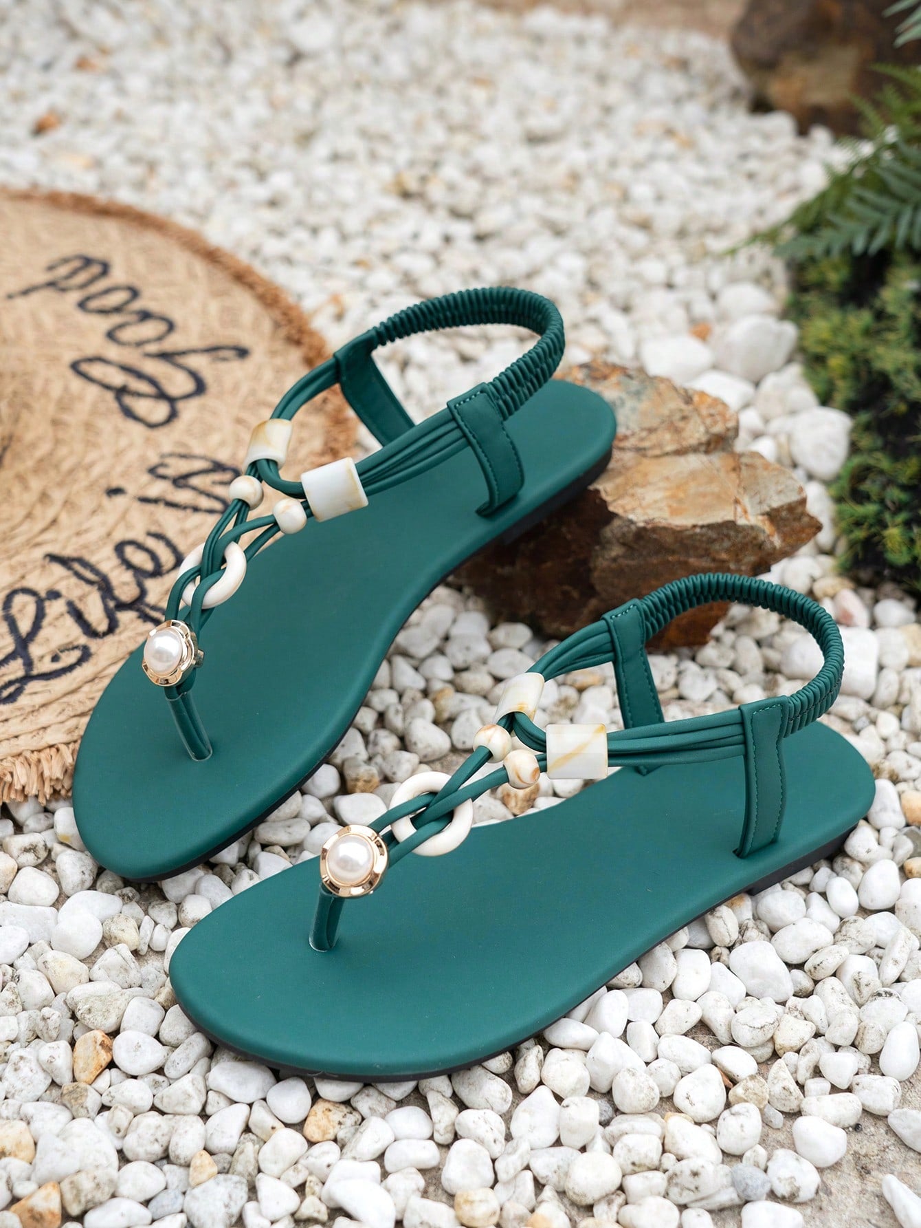 Women's beaded woven flip flop thong sandals with flat soft sole, toe-post design, and beach-style plant pattern detailing.