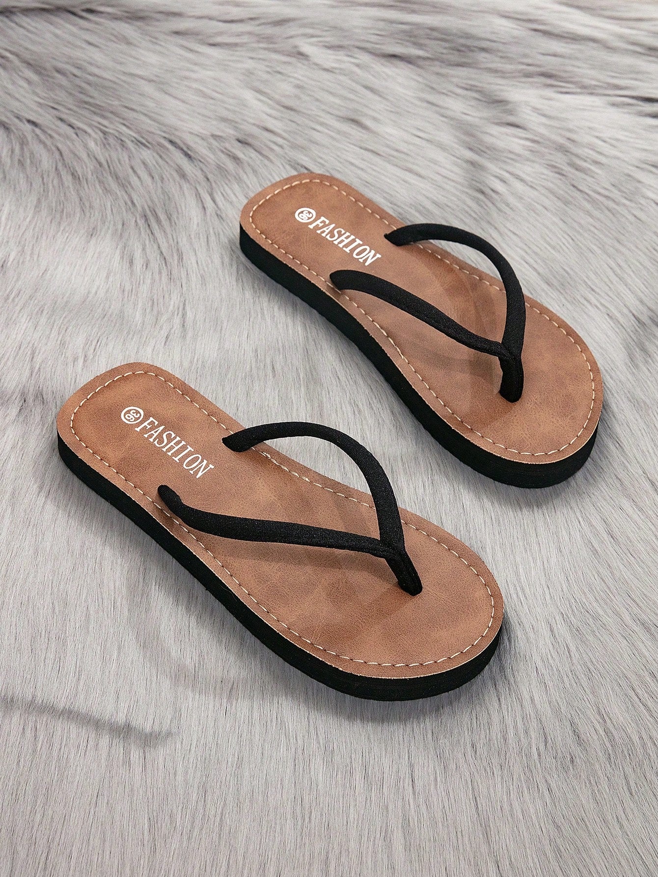 Women's flat thong flip flop sandals featuring braided knot detail and slip-on design for outdoor, beach, holiday, and travel wear.