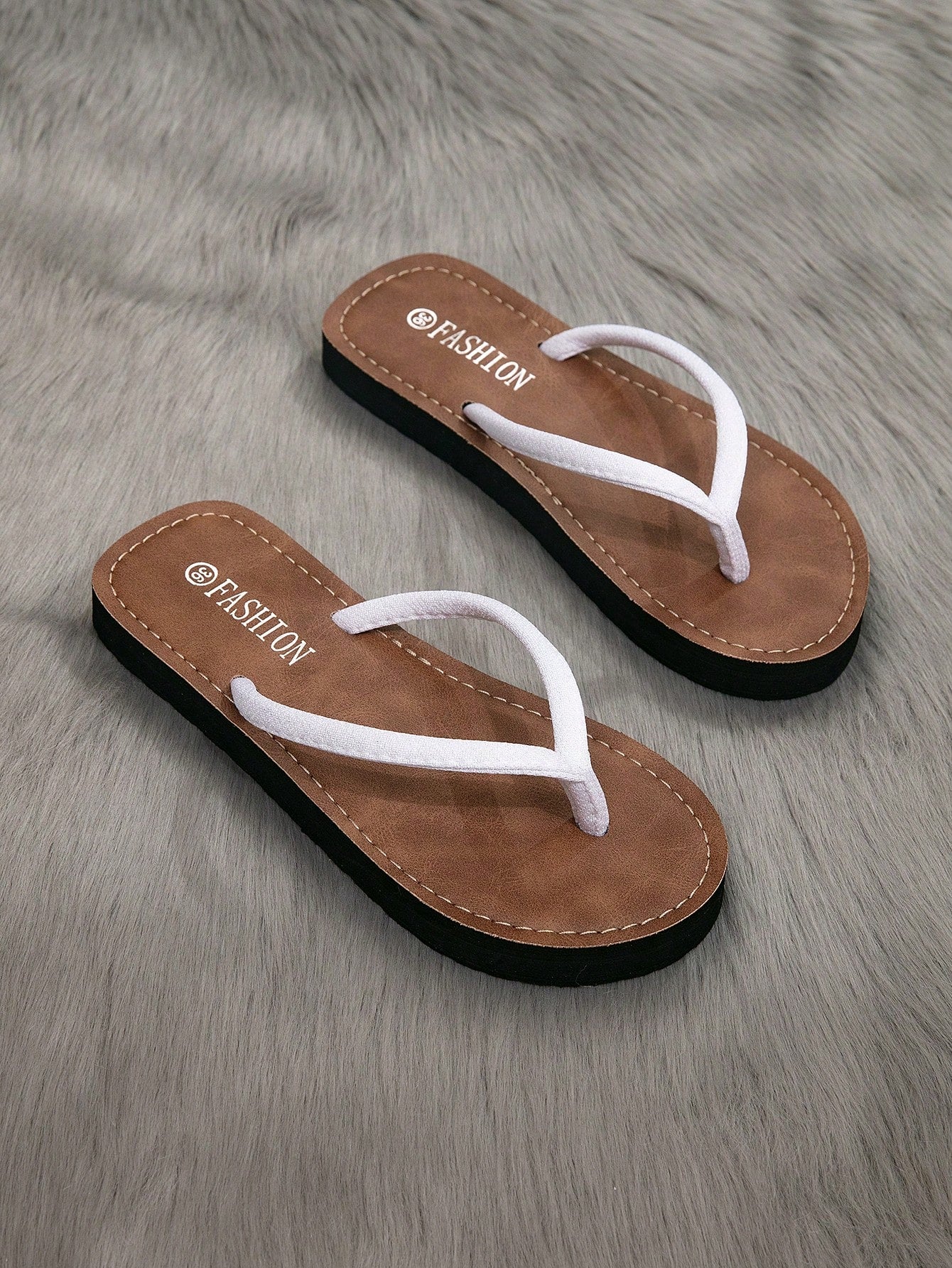 Women's flat thong flip flop sandals featuring braided knot detail and slip-on design for outdoor, beach, holiday, and travel wear.