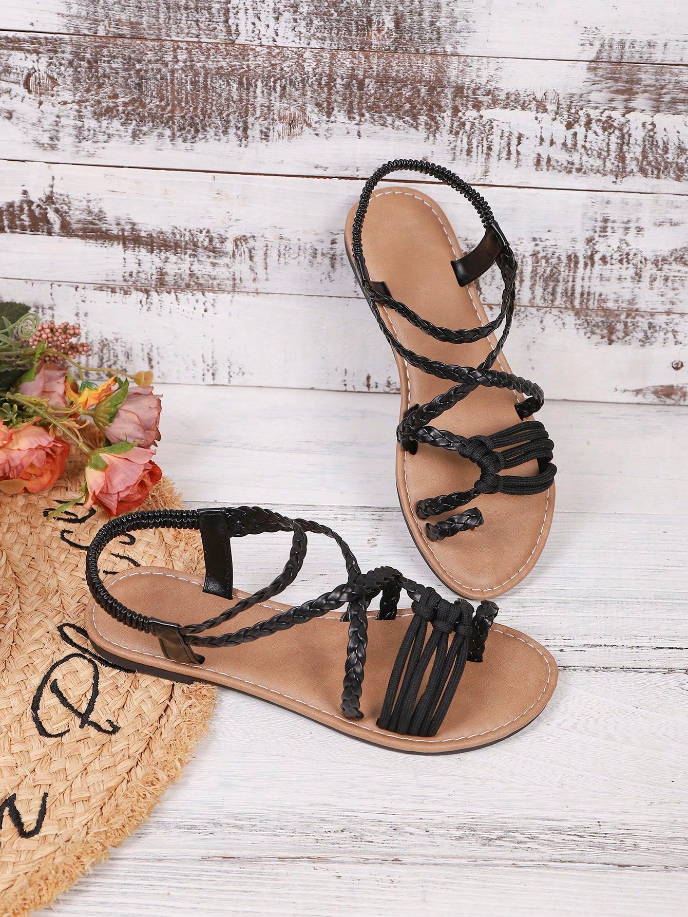 Women's woven criss-cross elastic flat sandals with braided strappy upper and toe post design