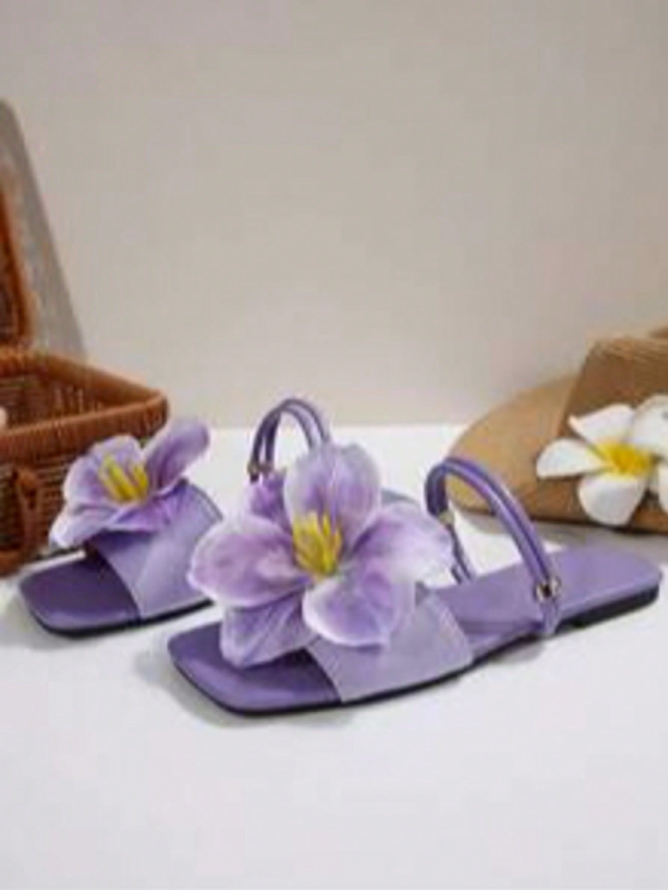 Women's open-toe flat slide sandals with a single strap and applique detail, glamorous casual style for beach and daily wear.
