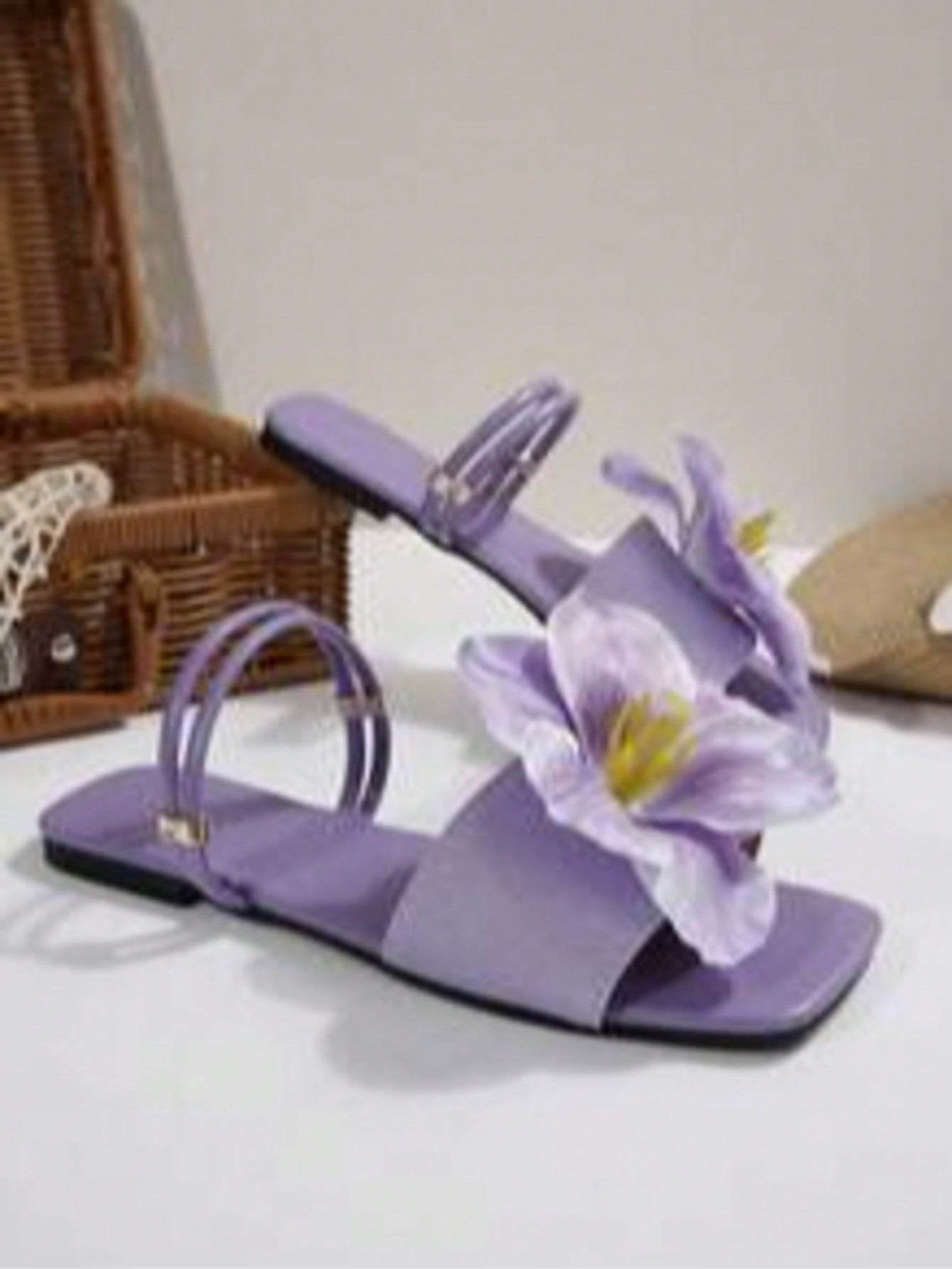 Women's open-toe flat slide sandals with a single strap and applique detail, glamorous casual style for beach and daily wear.