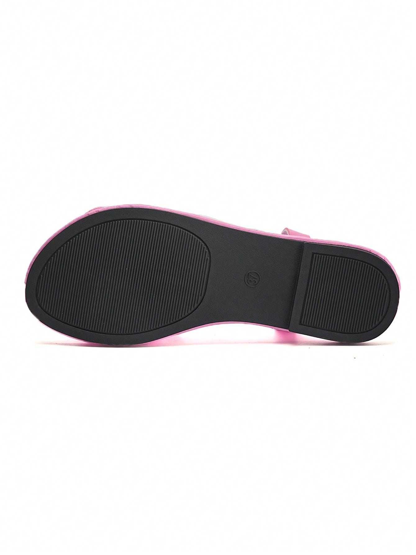 Women's open-toe flat slide sandals with crossed woven-look straps, floral appliqué detail, and buckle accent, shown in a casual beach style.