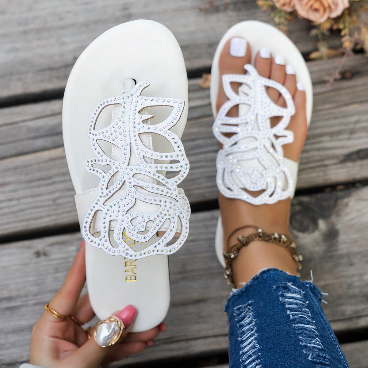 Women's flat sandals with strappy rope-detail design, plant pattern, and open-toe silhouette.
