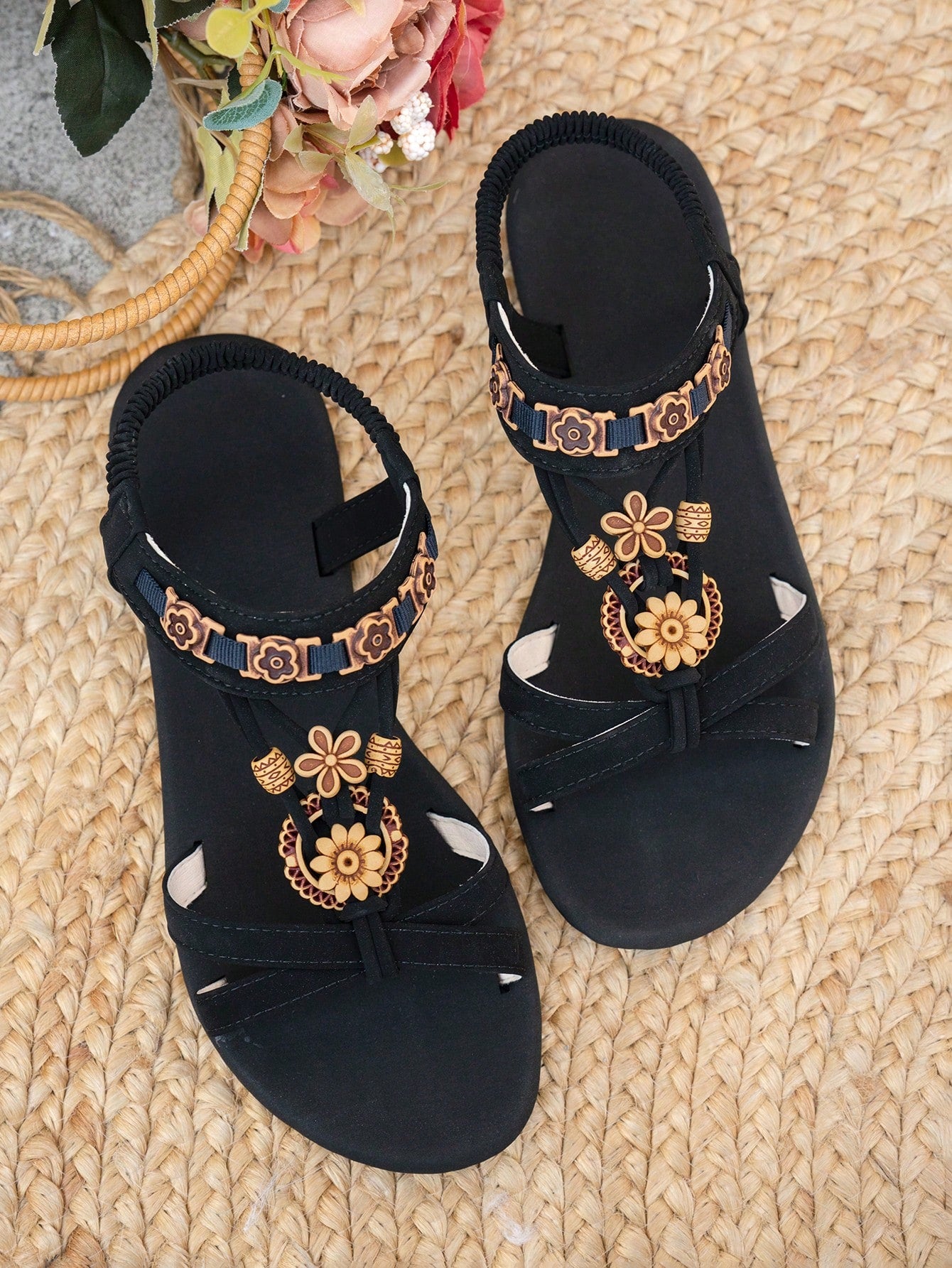 Women's flat slip-on sandals with open toe, plain solid-color look, beaded detail, and golden bar decor in a classic bohemian-inspired style.
