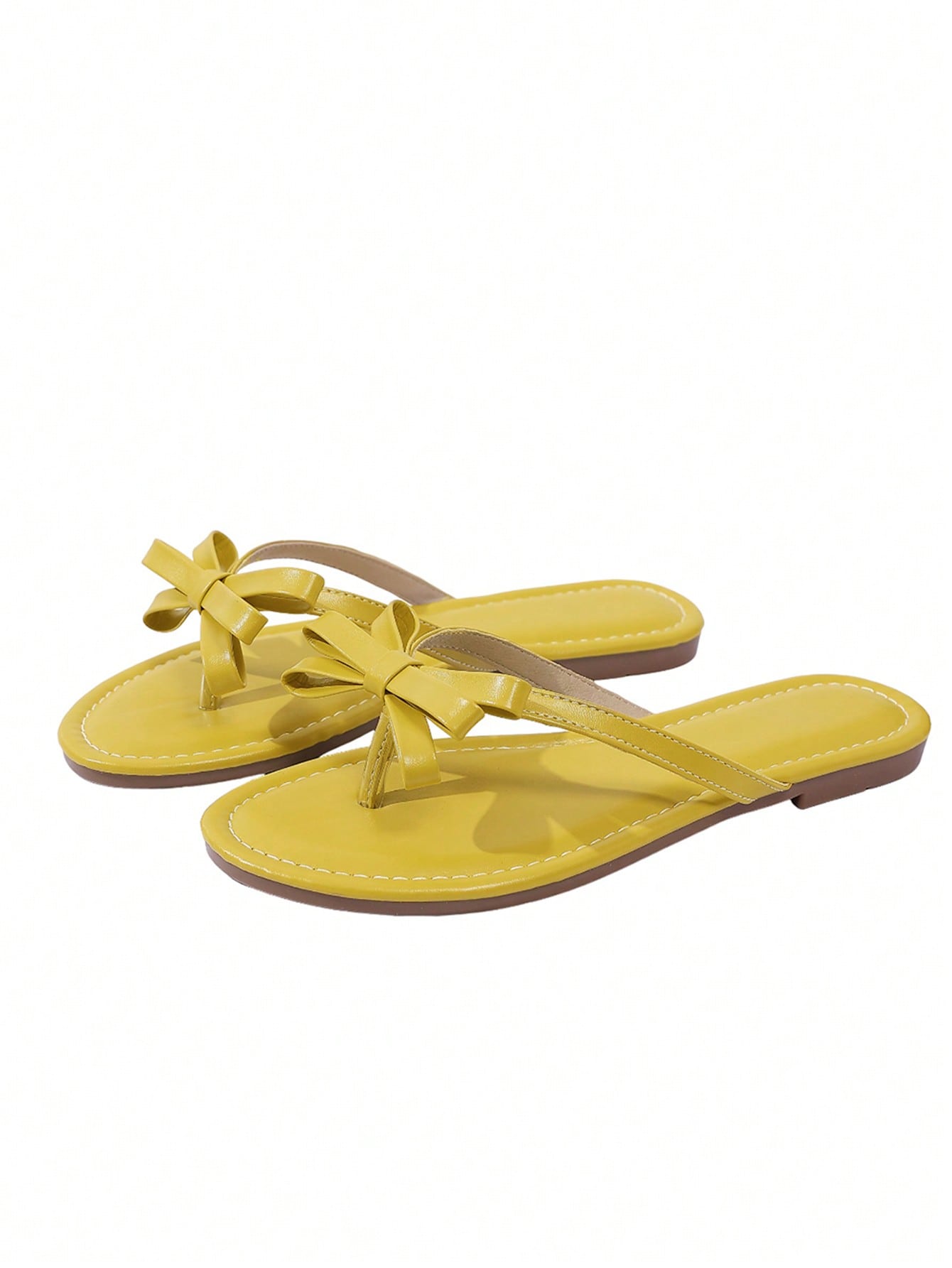 Women's flat slip-on slide sandals with textured PU leather look, bow detail on the upper, and toe-post design for casual vacation and beach wear.