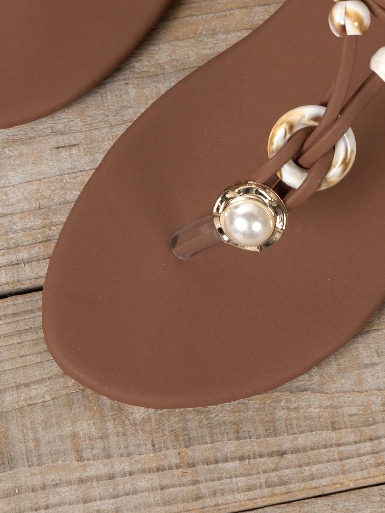 Women's beaded woven flip flop thong sandals with flat soft sole, toe-post design, and beach-style plant pattern detailing.