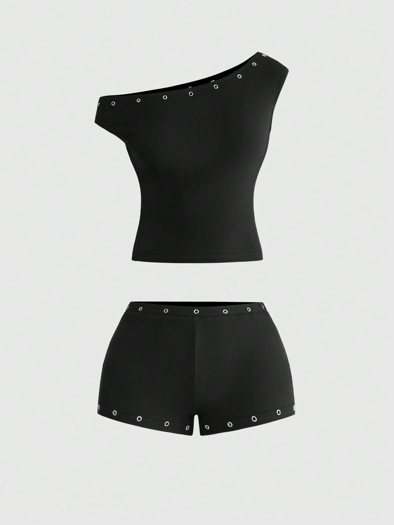 Women's two-piece outfit with an asymmetric neck studded grommet crop top and super low-rise mini shorts