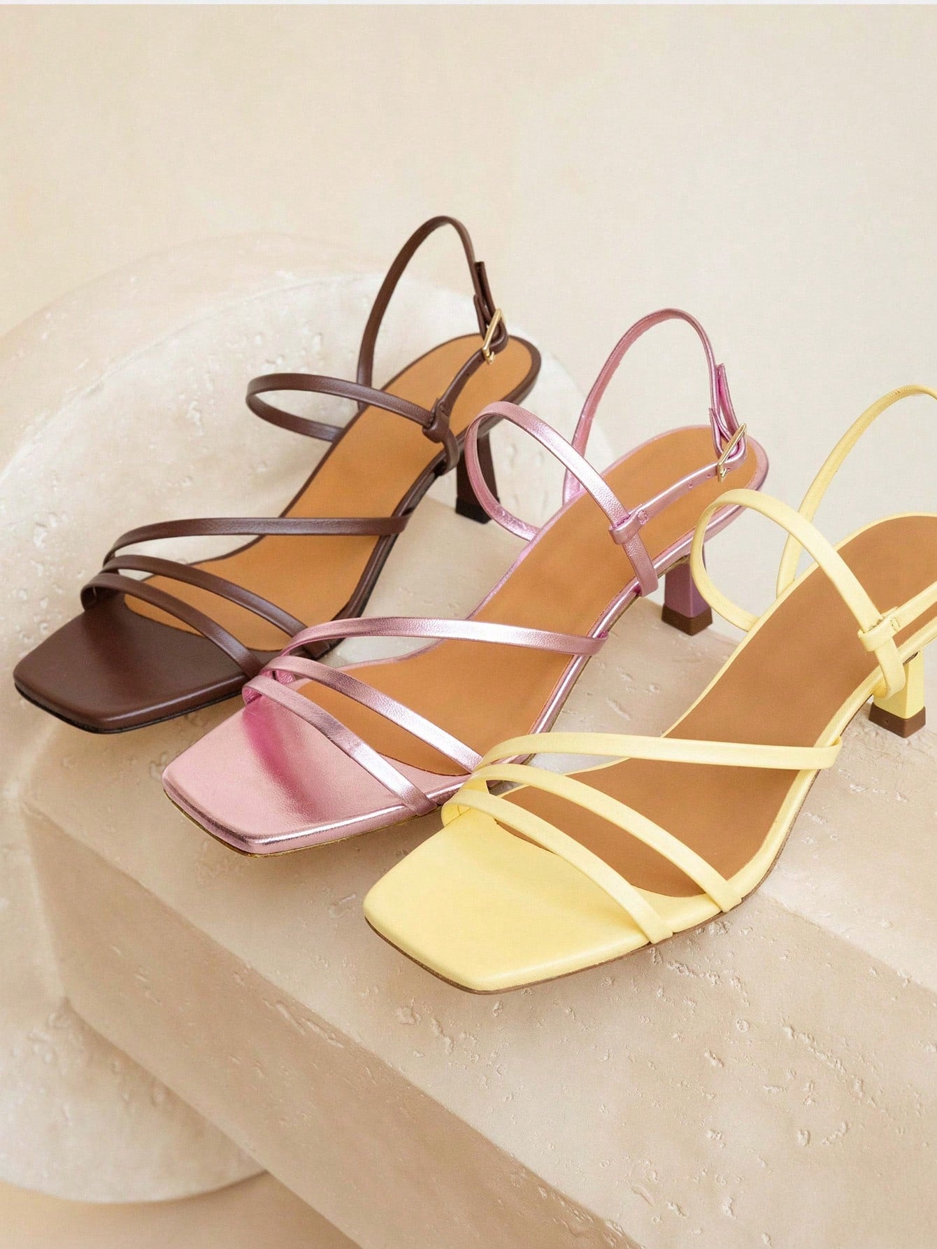 Elegant women’s slip-on high heel sandals with a square toe, bowknot detail, textured upper, stiletto heel, and slingback toe-post design.