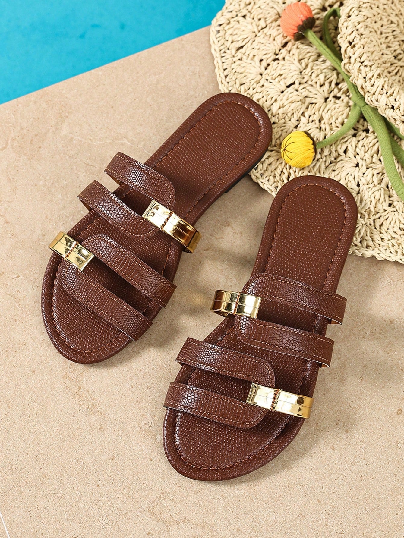 Women's yellow open-toe flat slide sandals featuring a cut-out design and textured plain pattern for casual beach and daily wear.