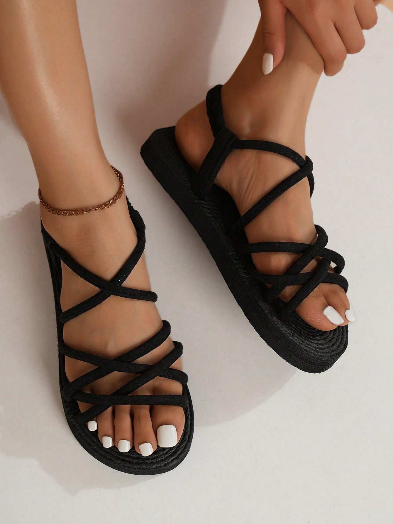 Women's colorblock flat slide sandals with criss cross strap, toe post, cloth tape and fleece detail, finished with sequin, crystal, gemstone, and knot accents.