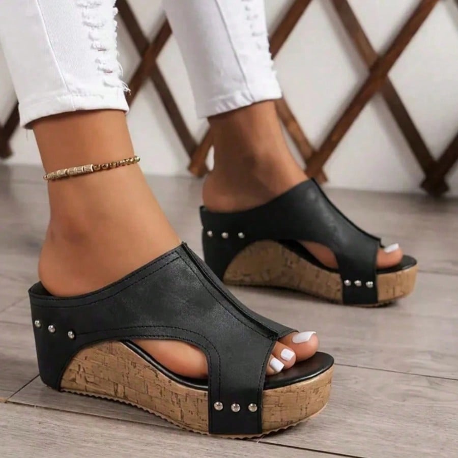 Women's plain slip-on slippers with a round toe, platform sole, and studded details, designed for casual daily wear and vacation outfits.
