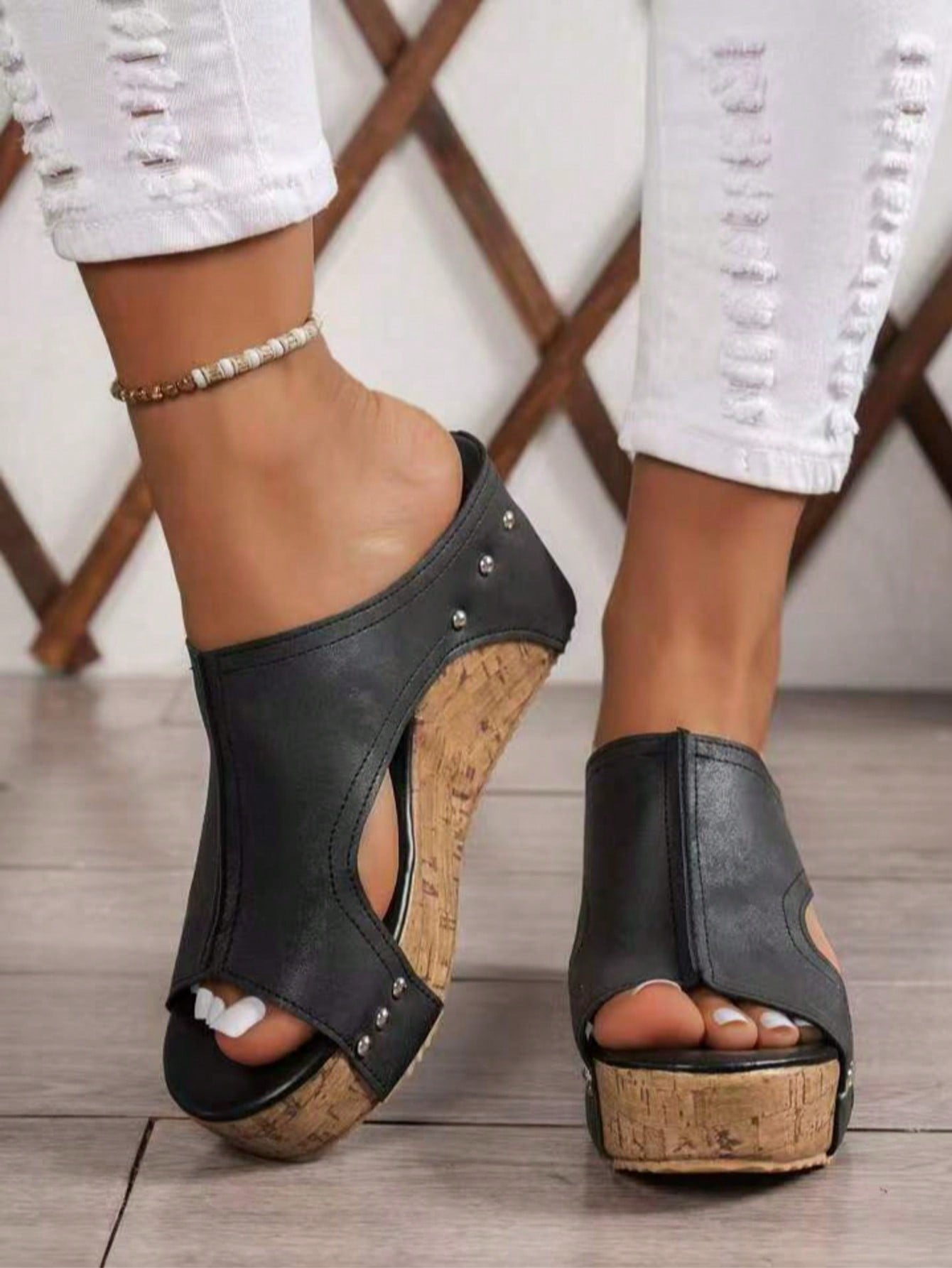 Women's plain slip-on slippers with a round toe, platform sole, and studded details, designed for casual daily wear and vacation outfits.