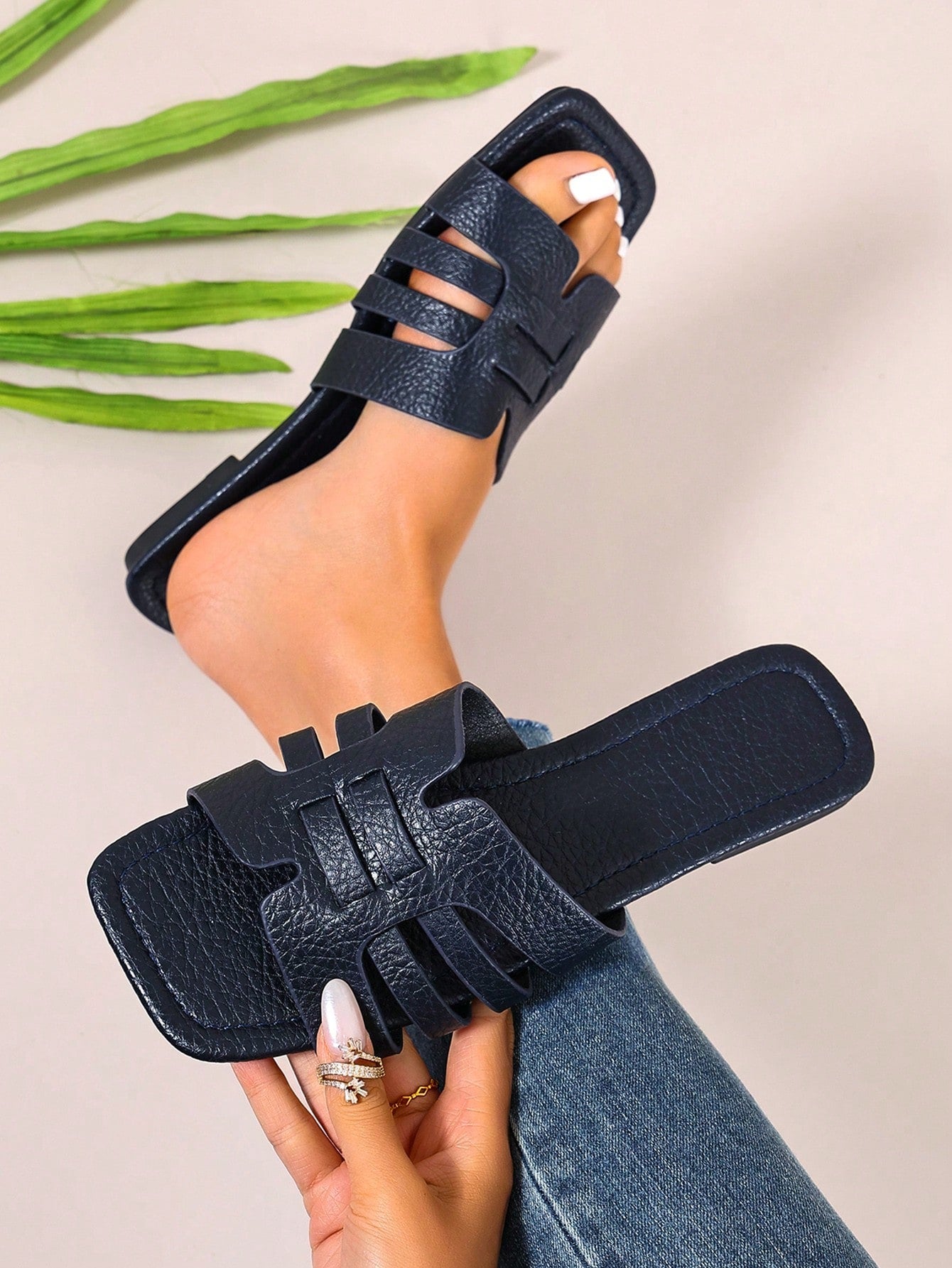 Women's open-toe flat slide sandals with slip-on design and metal decoration, suitable for outdoor casual summer wear.
