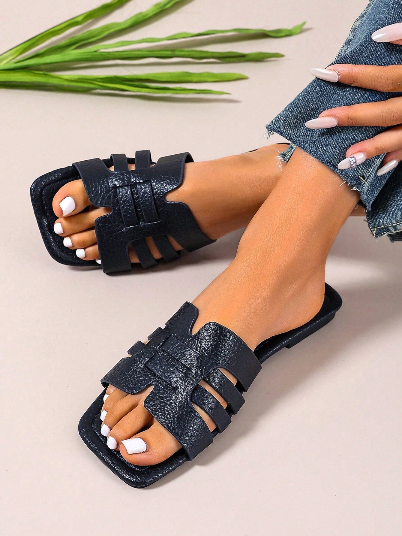 Women's open-toe flat slide sandals with slip-on design and metal decoration, suitable for outdoor casual summer wear.