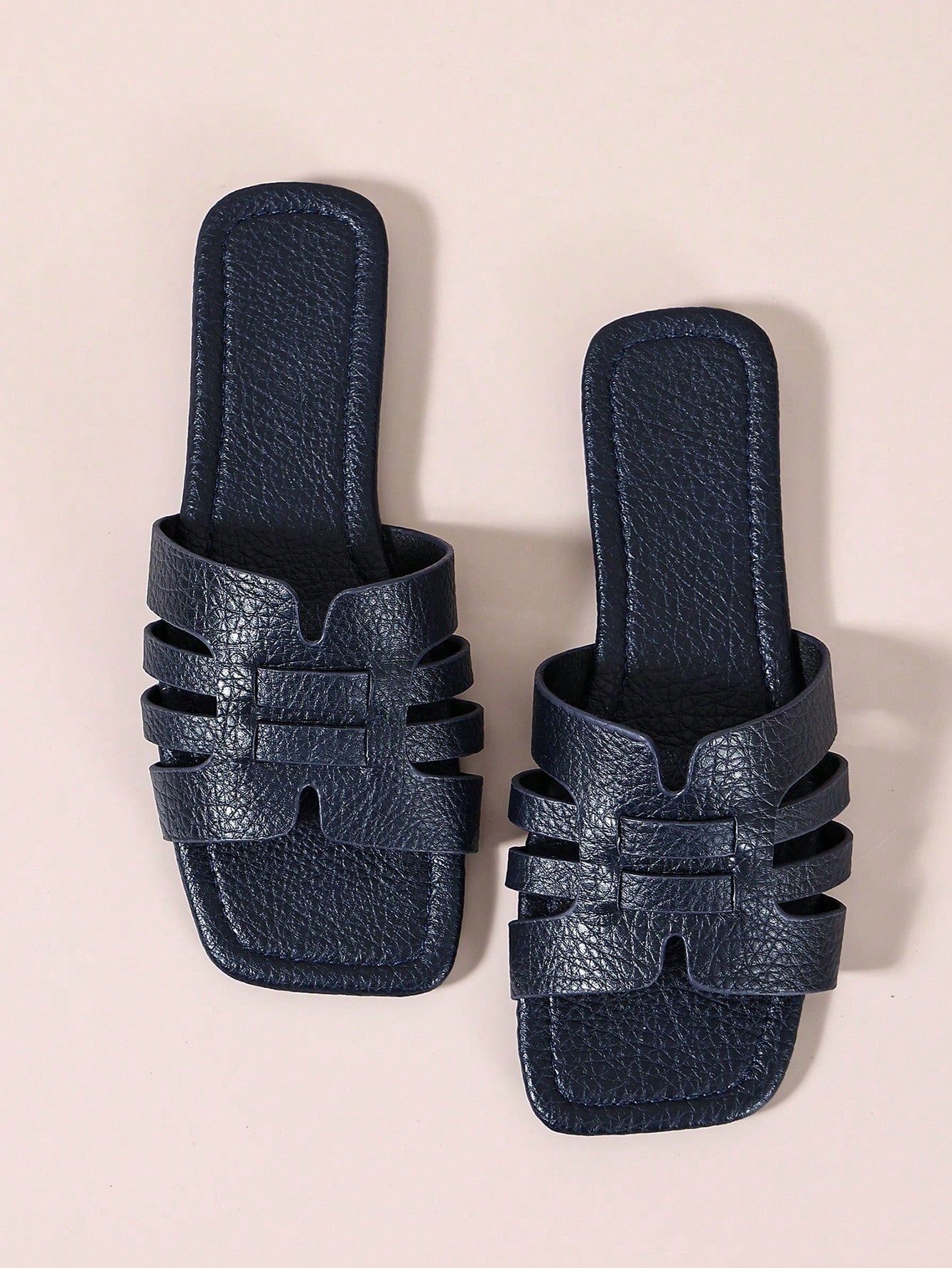 Women's open-toe flat slide sandals with slip-on design and metal decoration, suitable for outdoor casual summer wear.