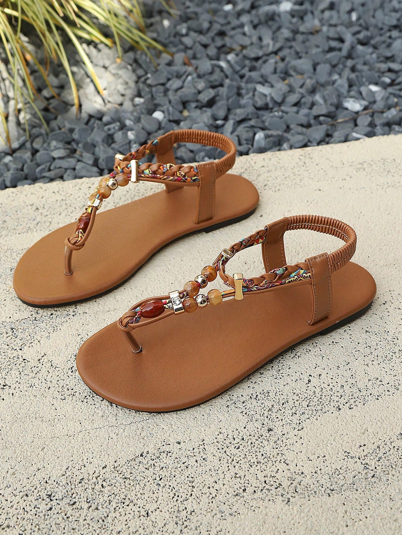 Women's beaded open-toe thong flat sandals in slip-on style for outdoor and beach casual wear.