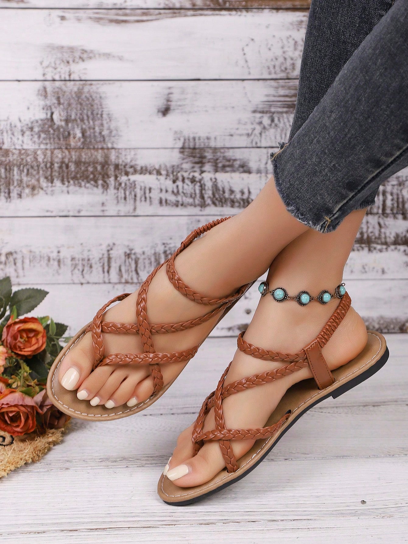 Women's woven criss-cross elastic flat sandals with braided strappy upper and toe post design