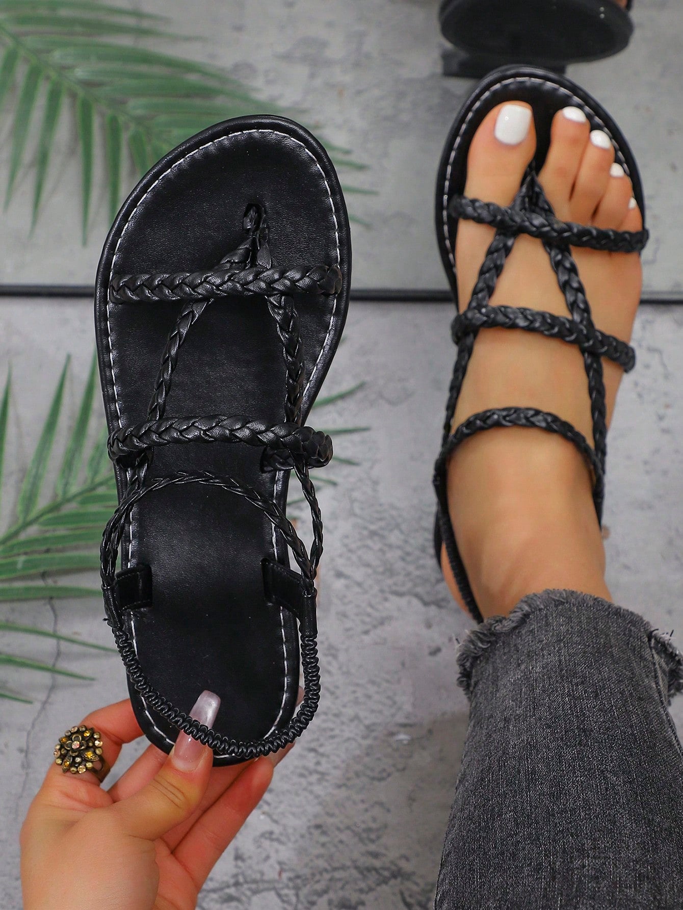 Women's woven criss-cross elastic flat sandals with braided strappy upper and toe post design