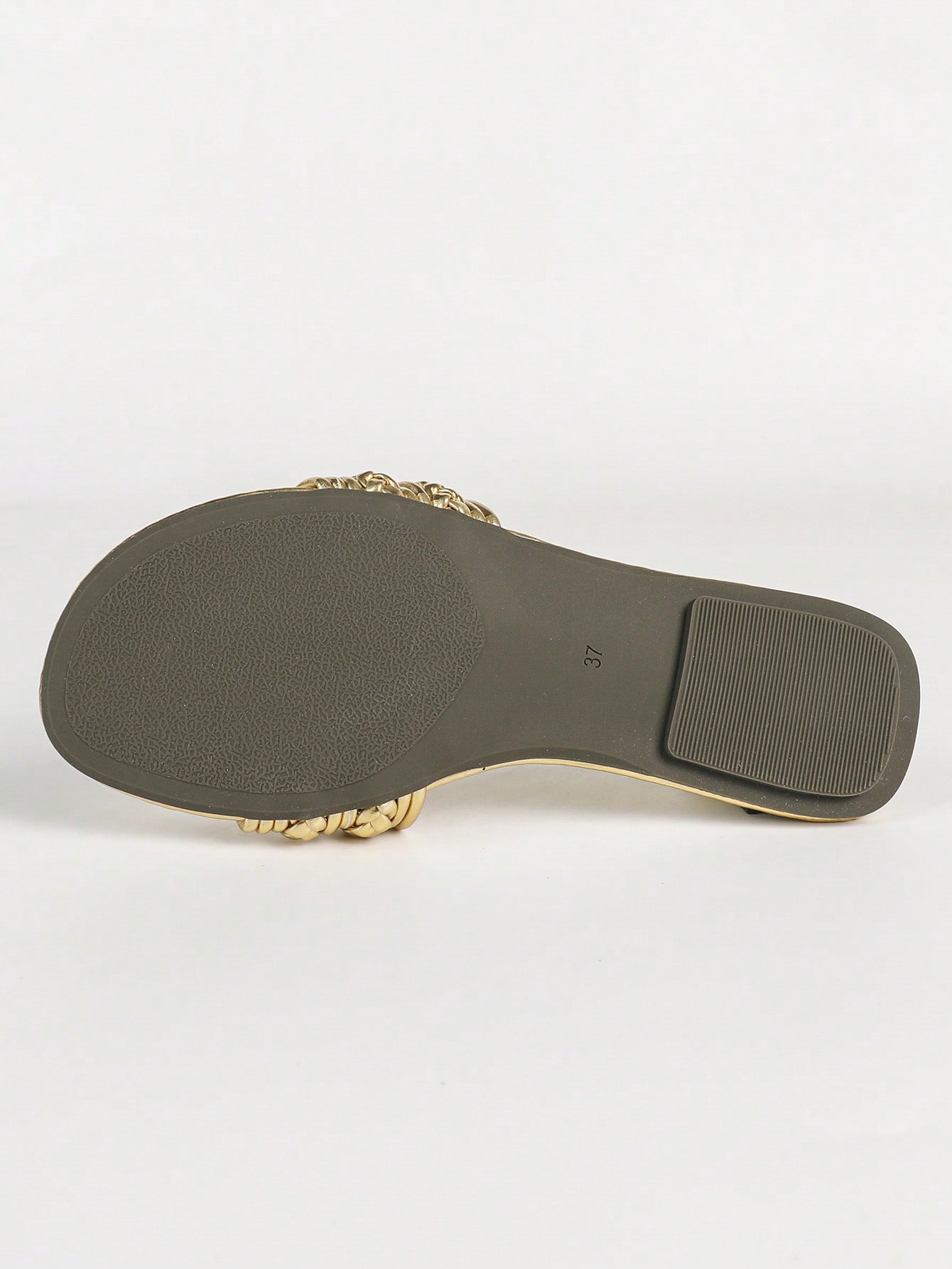 Women's gold flat sandals with metal accent detail, strappy lace-up design, and toe post thong style.