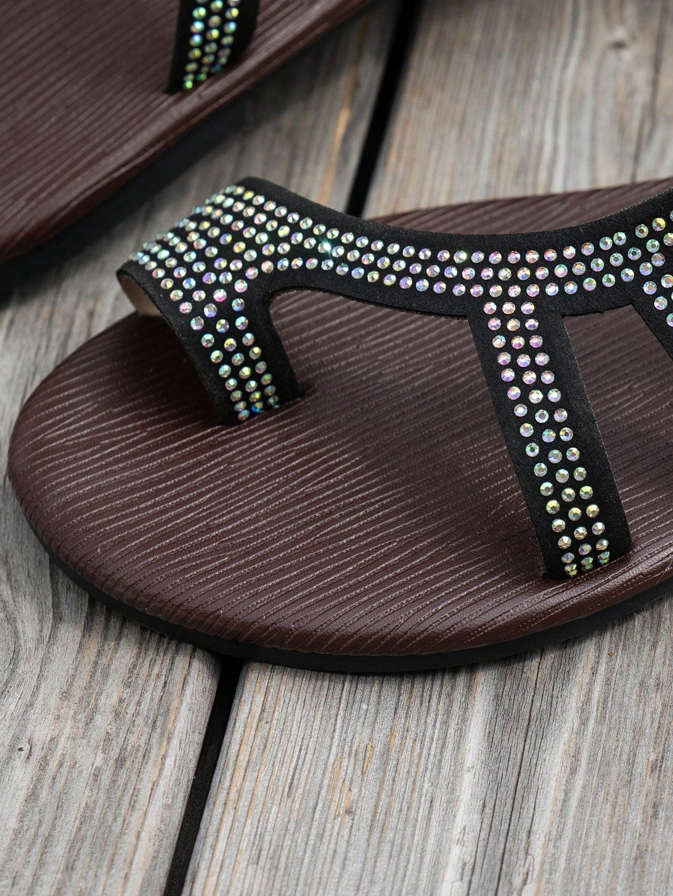 Women's flat sandals with strappy rope-detail design, plant pattern, and open-toe silhouette.
