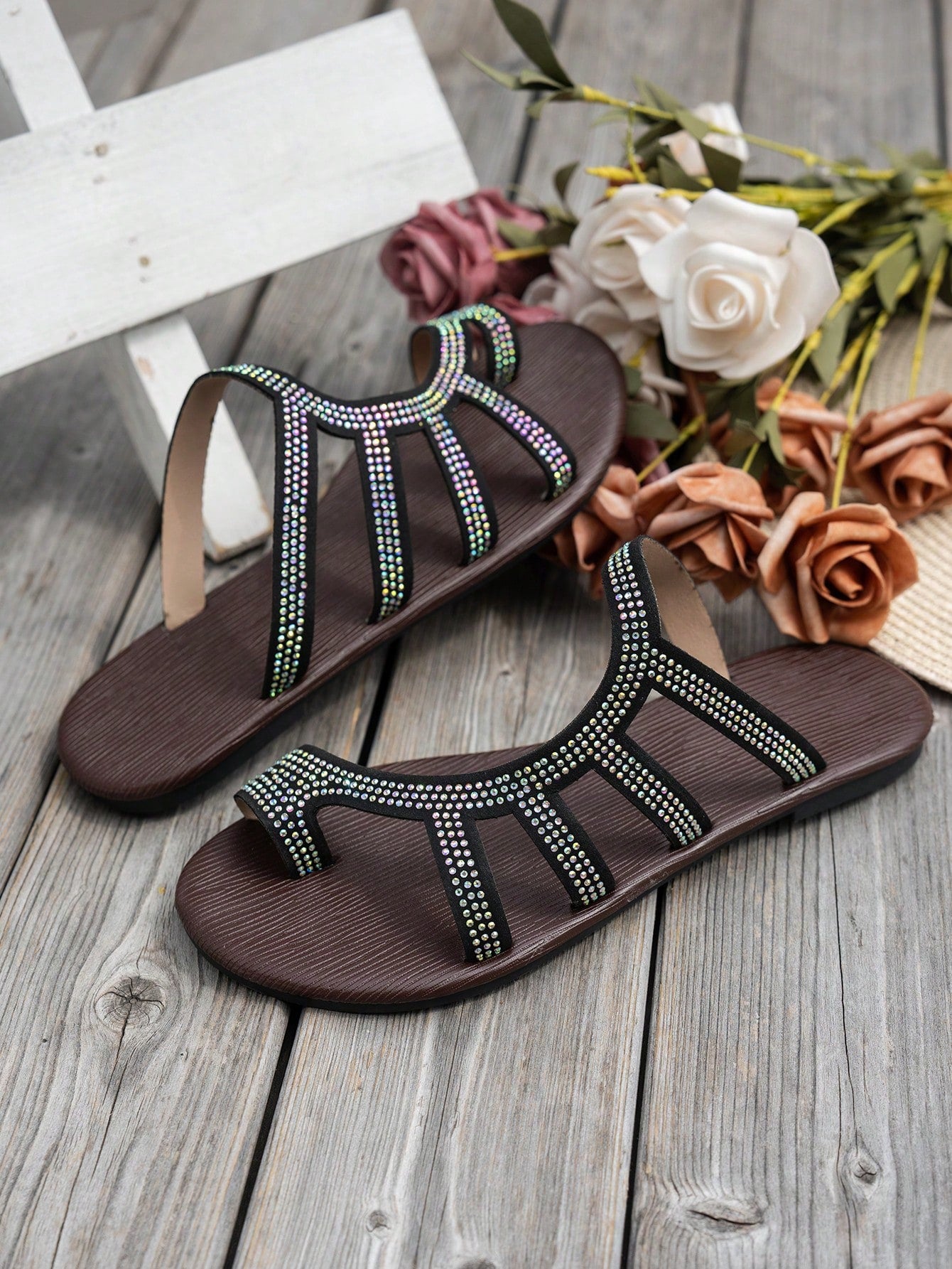 Women's flat sandals with strappy rope-detail design, plant pattern, and open-toe silhouette.