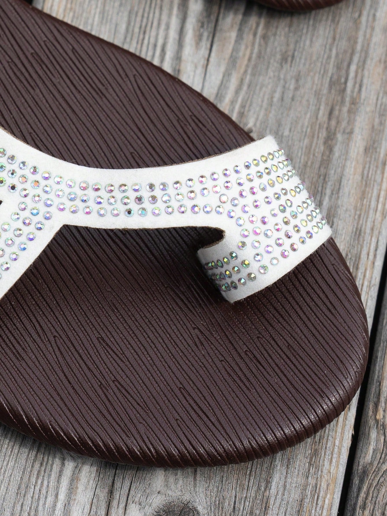 Women's flat sandals with strappy rope-detail design, plant pattern, and open-toe silhouette.