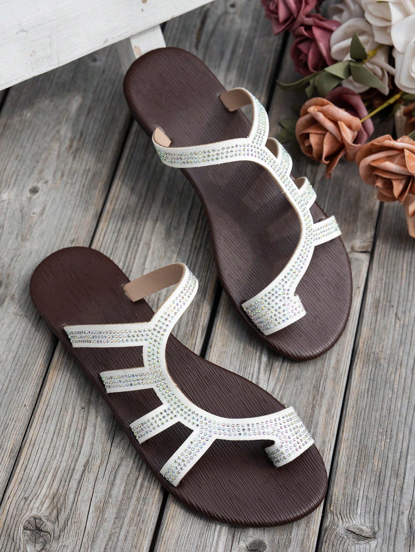 Women's flat sandals with strappy rope-detail design, plant pattern, and open-toe silhouette.