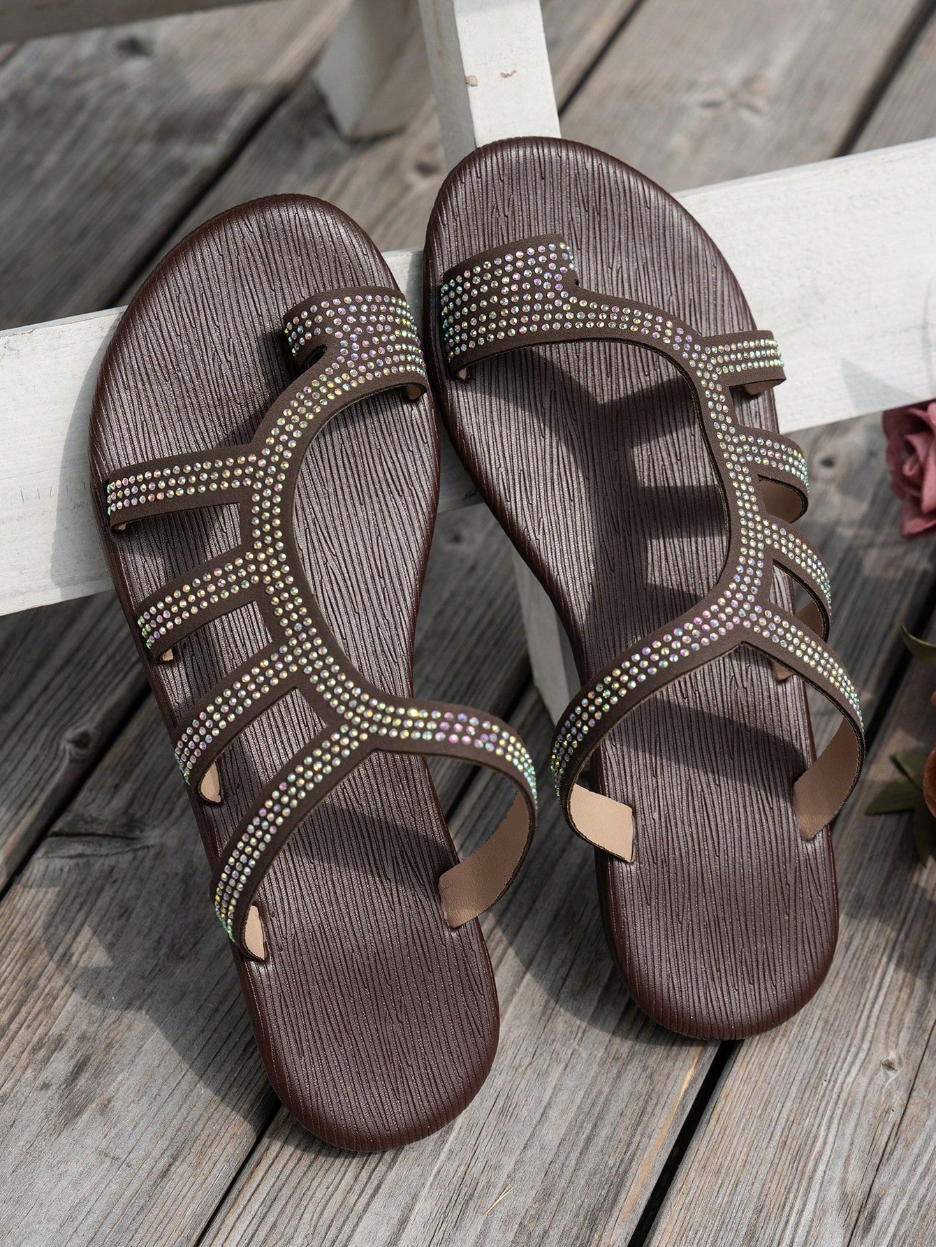 Women's flat sandals with strappy rope-detail design, plant pattern, and open-toe silhouette.