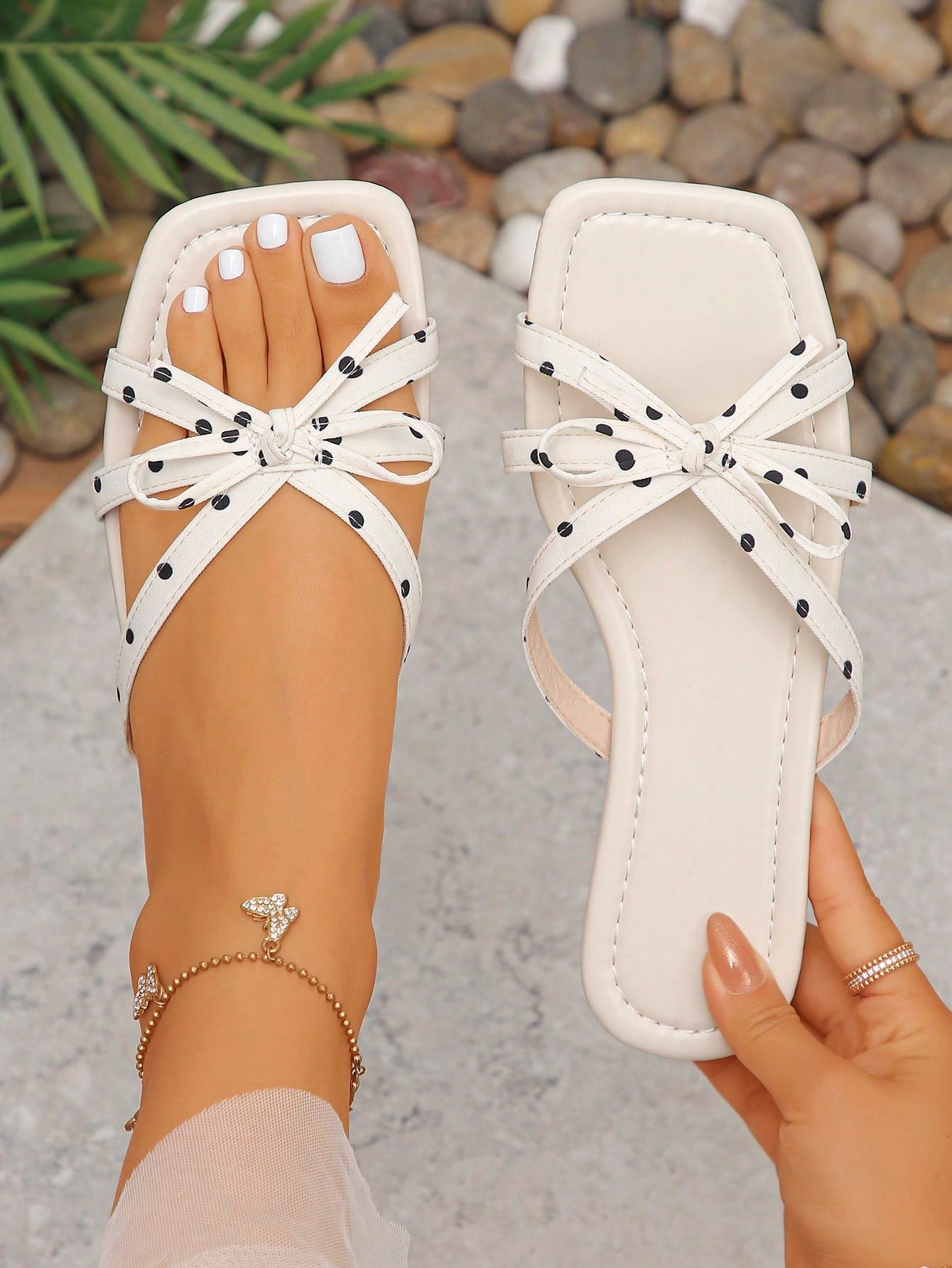 Women's casual flat slip-on slide sandals with bow decor, dual-tone geometric pattern, and open toe design for beach and daily summer wear.