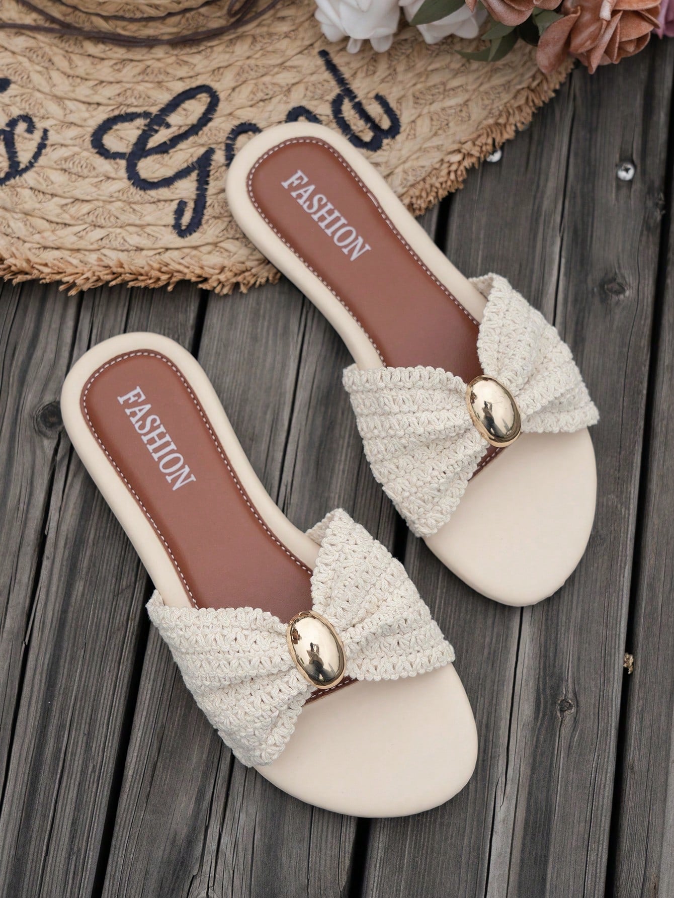 Women's brown straw woven flat slide sandals with bowknot metal decor, braided open-toe strap, and round toe.