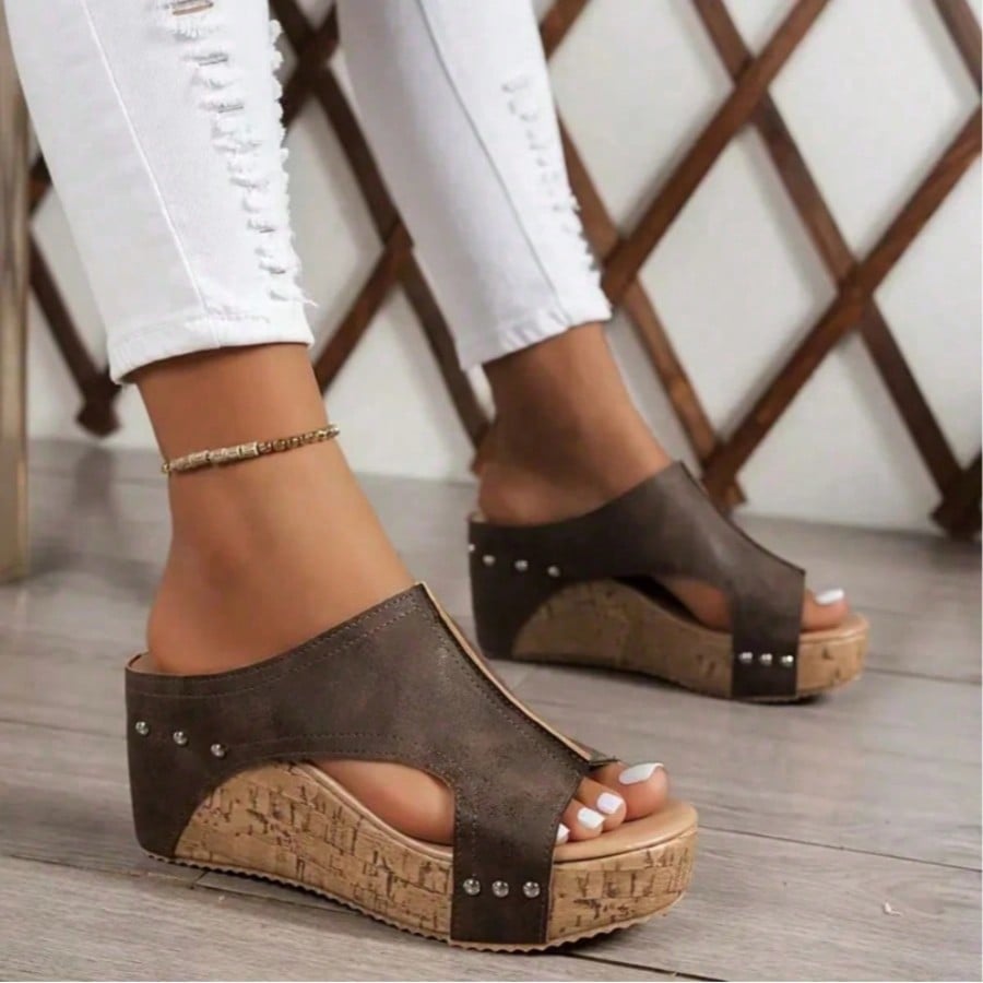 Women's plain slip-on slippers with a round toe, platform sole, and studded details, designed for casual daily wear and vacation outfits.