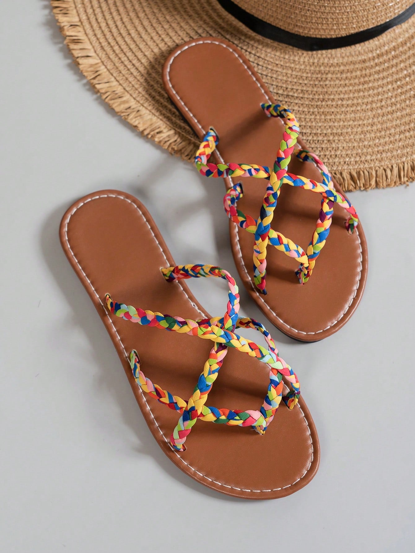 Women’s leopard print woven flat slide sandals with cut-out details and open toe silhouette, casual beach-style slip-on design.