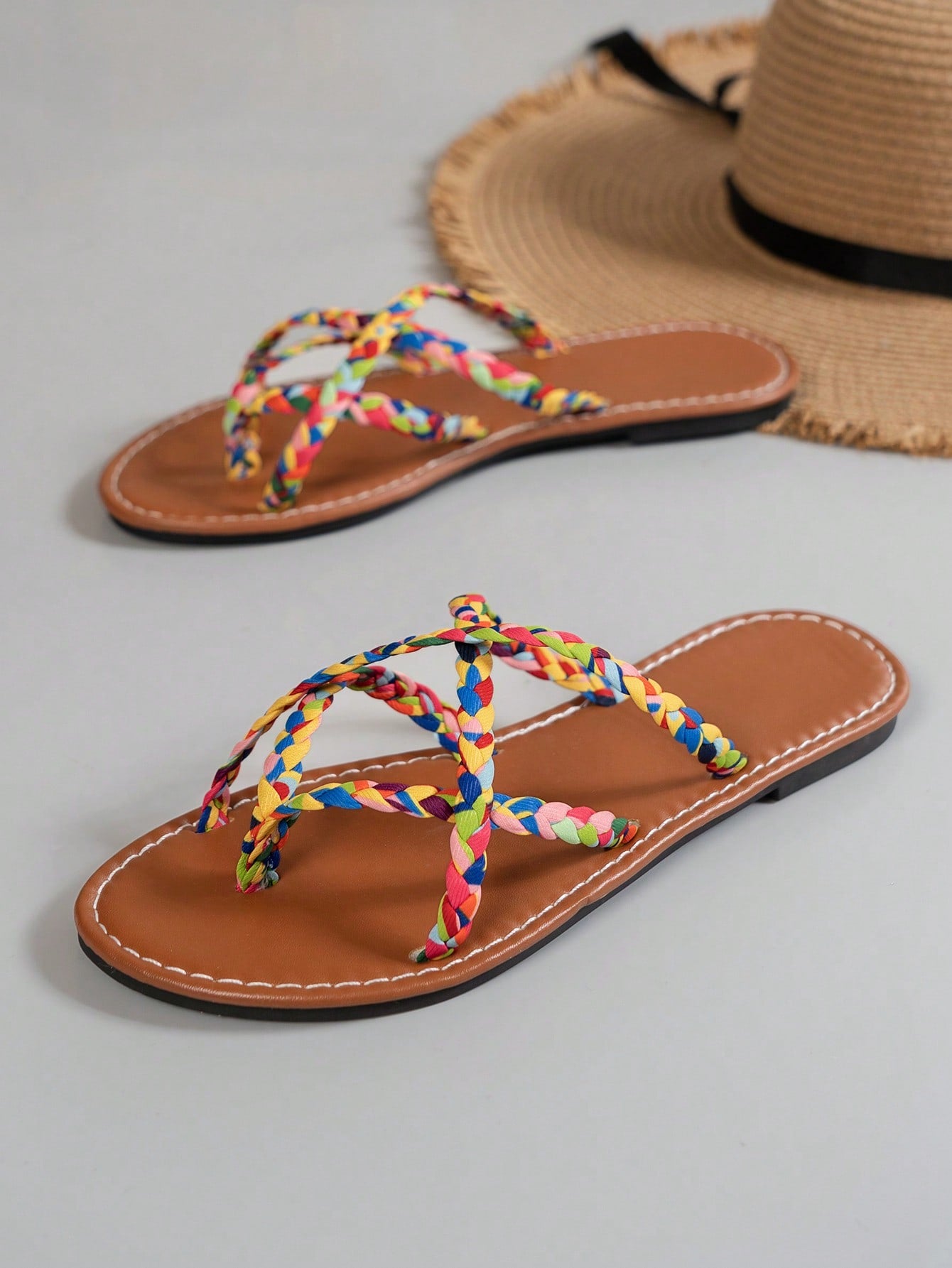 Women’s leopard print woven flat slide sandals with cut-out details and open toe silhouette, casual beach-style slip-on design.