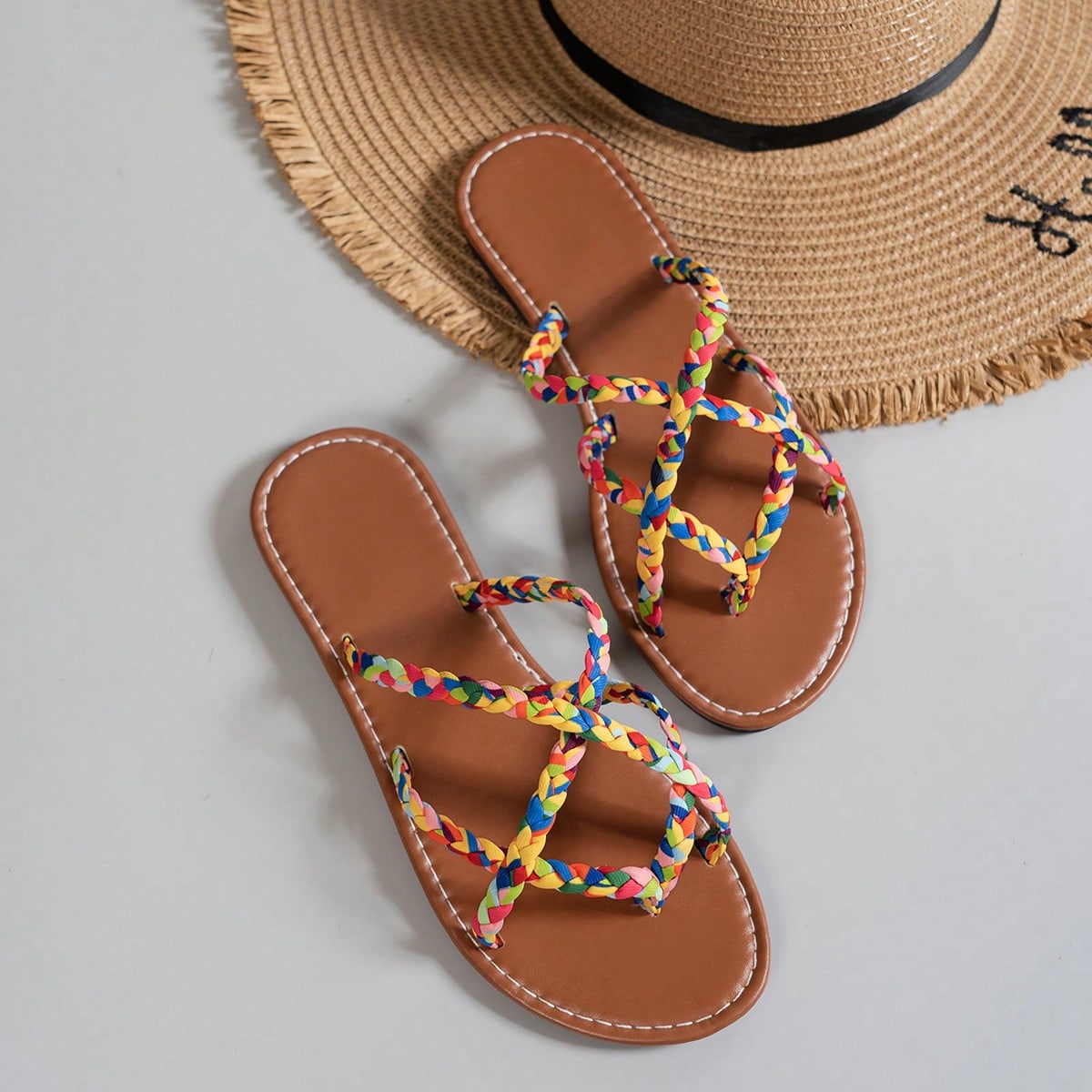 Women’s leopard print woven flat slide sandals with cut-out details and open toe silhouette, casual beach-style slip-on design.