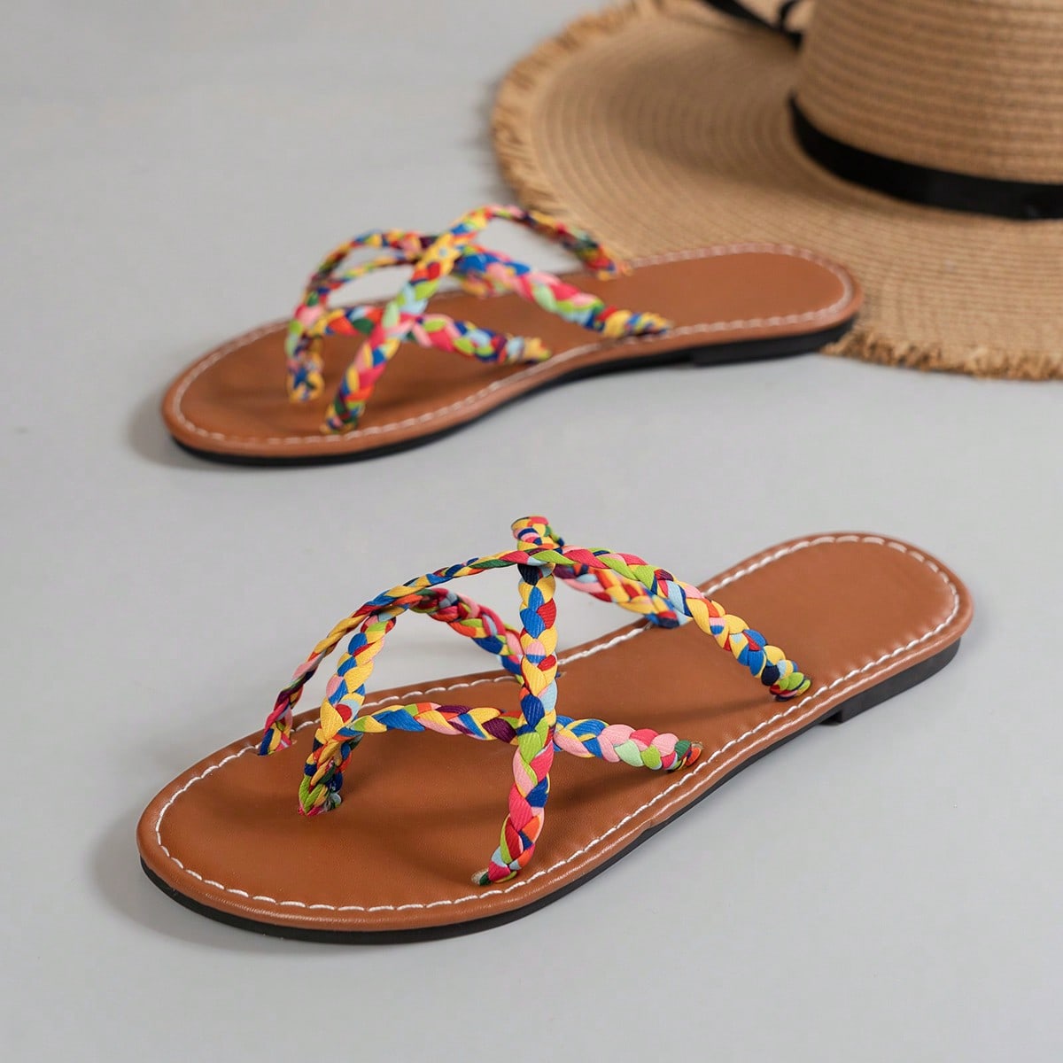 Women’s leopard print woven flat slide sandals with cut-out details and open toe silhouette, casual beach-style slip-on design.