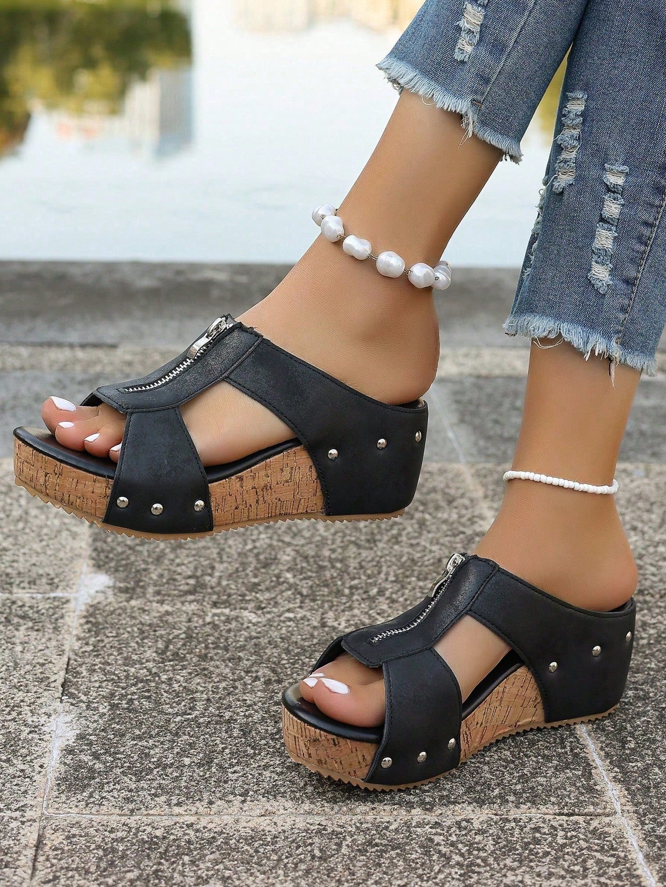 Women's plain slip-on slippers with a round toe, platform sole, and studded details, designed for casual daily wear and vacation outfits.