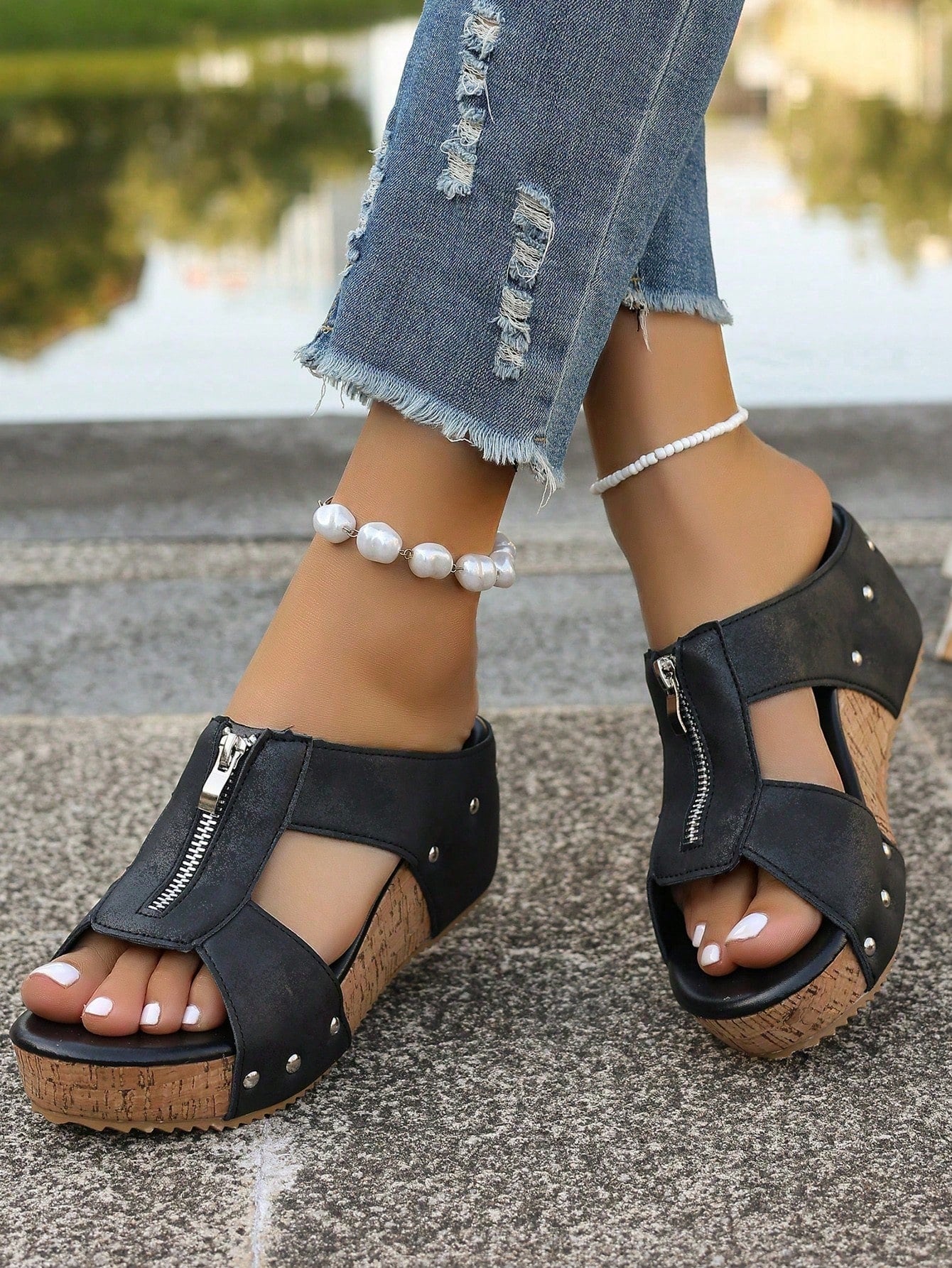 Women's plain slip-on slippers with a round toe, platform sole, and studded details, designed for casual daily wear and vacation outfits.