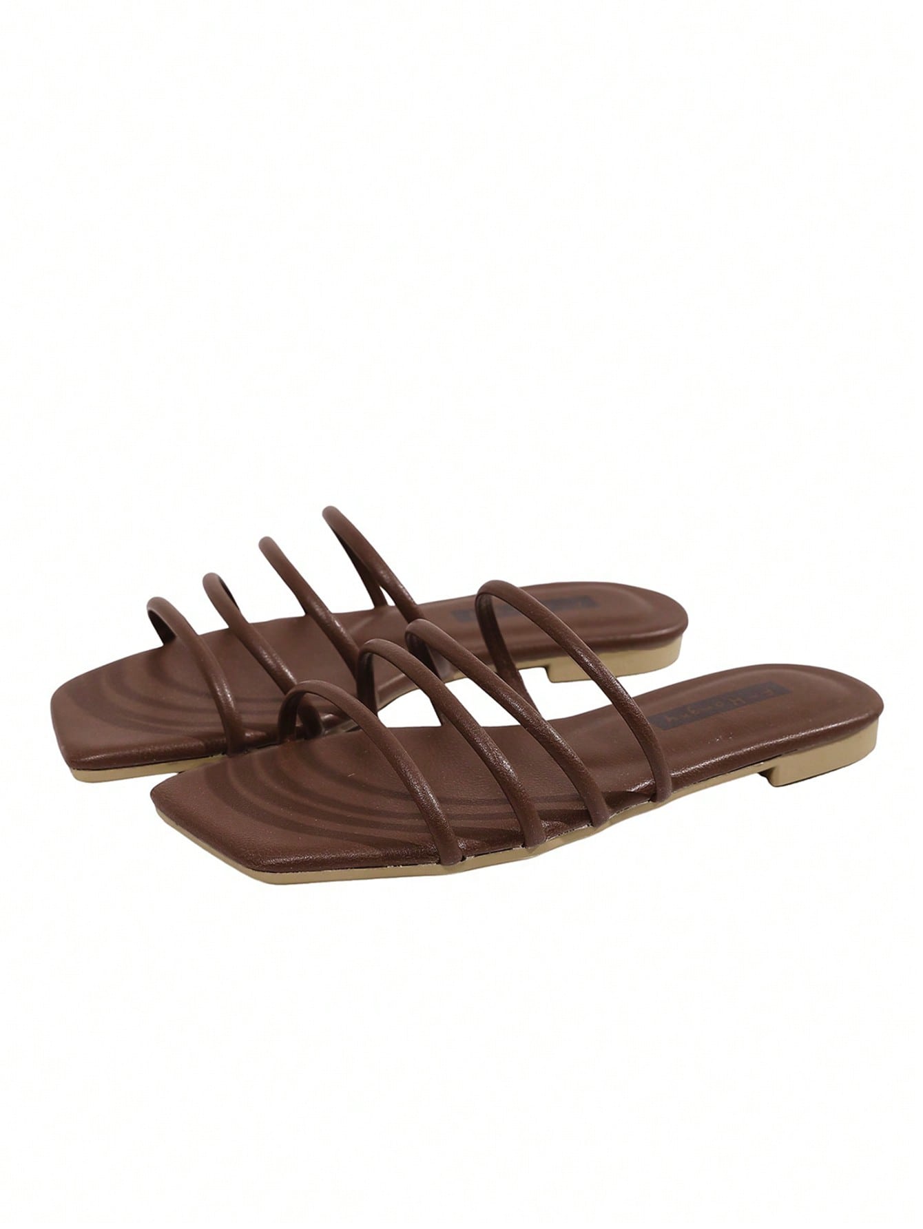 Women's slip-on flat slide sandals with bow tie decor, textured plain upper, and open toe.