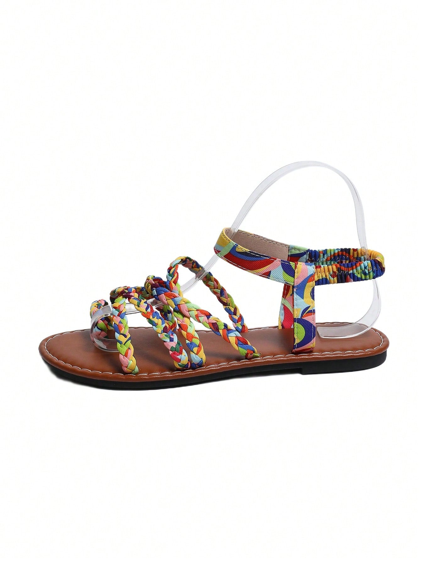 Women's flat sandals featuring a solid-color design with criss-cross braided straps and a toe-post slide style, suitable for beach, vacation, and casual wear.