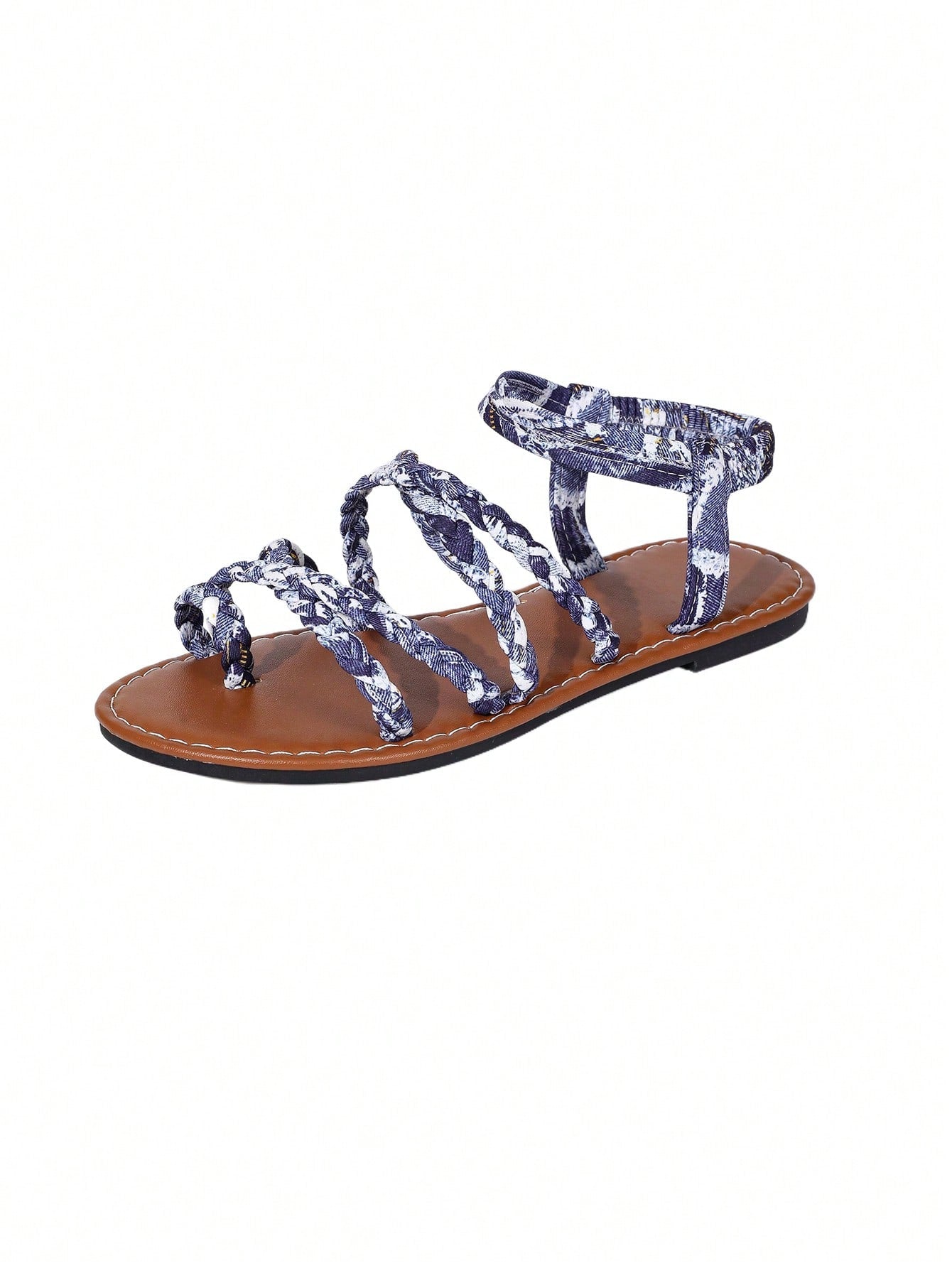 Women's flat sandals featuring a solid-color design with criss-cross braided straps and a toe-post slide style, suitable for beach, vacation, and casual wear.