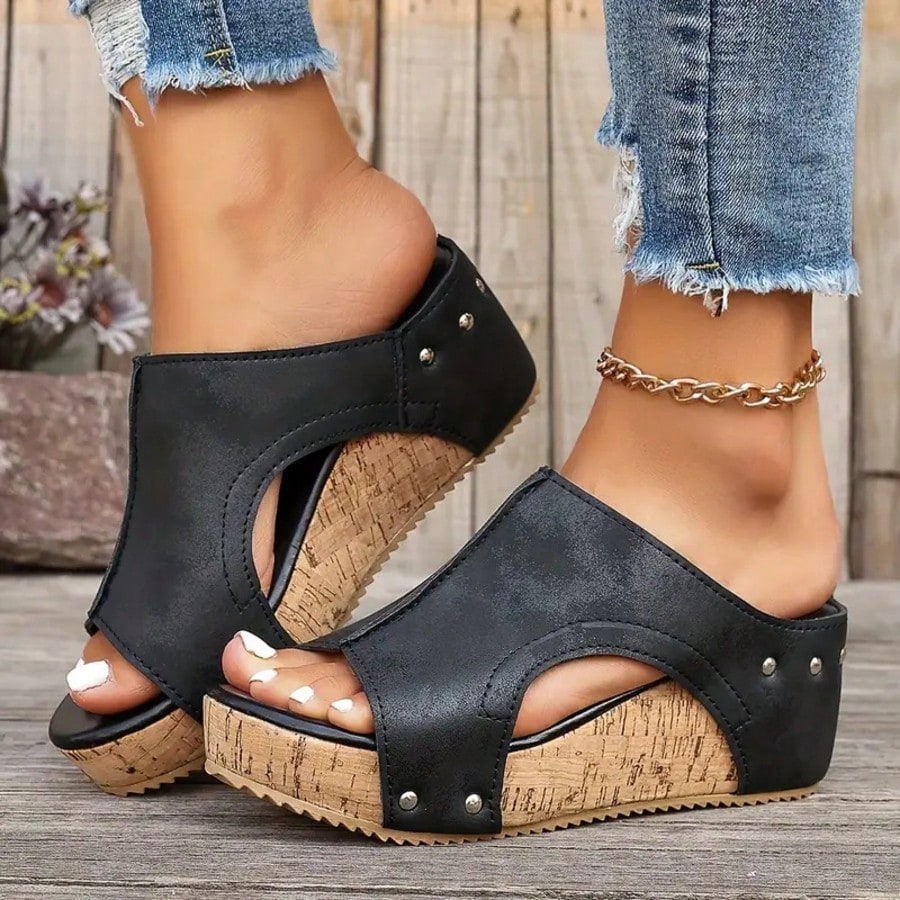 Women's plain slip-on slippers with a round toe, platform sole, and studded details, designed for casual daily wear and vacation outfits.